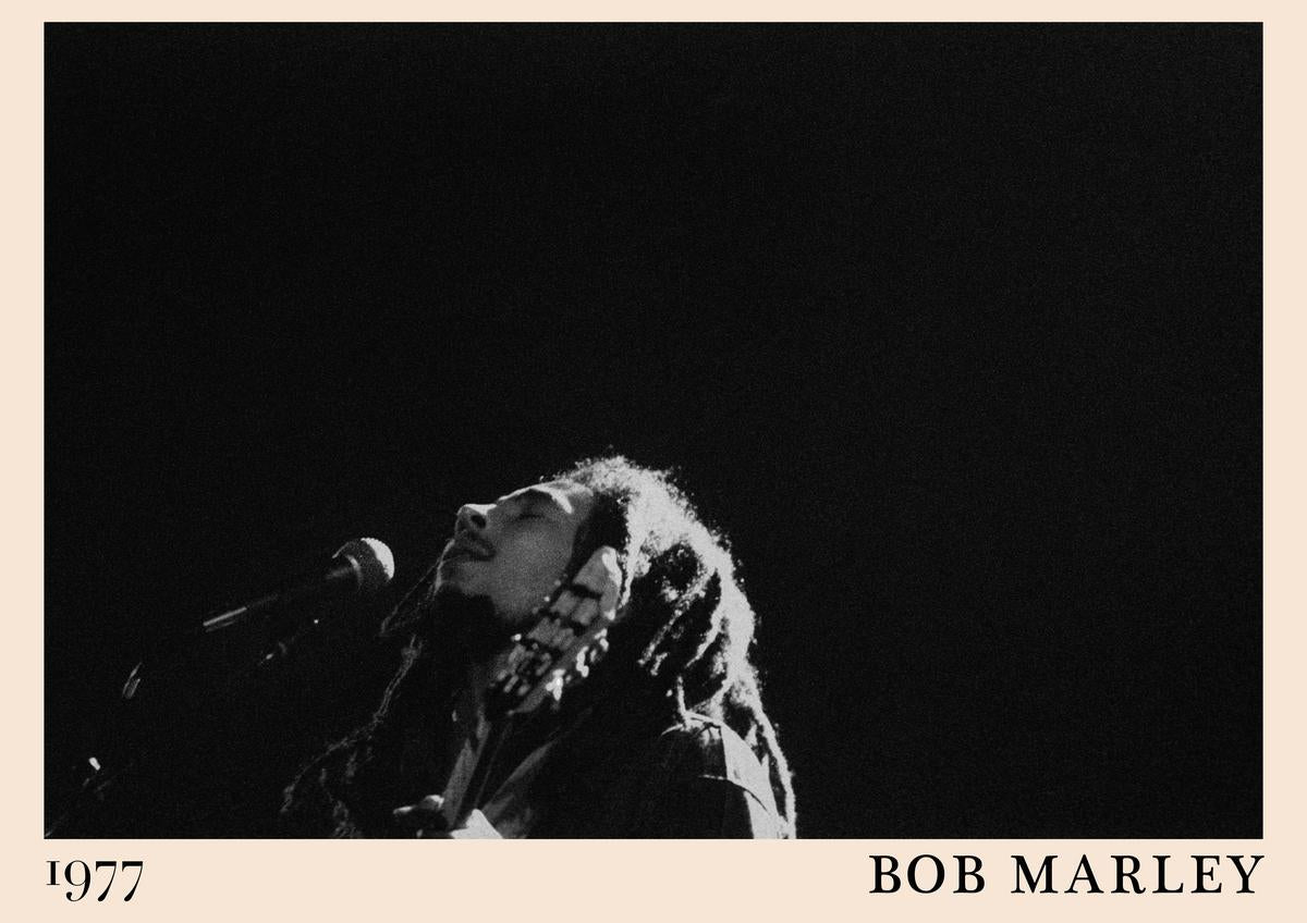 Poster featuring a black and white photo of Bob Marley singing and playing guitar, cream border with "1977" and "BOB MARLEY",