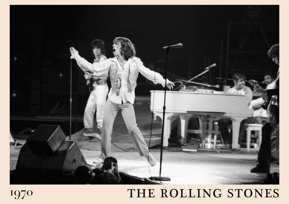 Poster featuring The Rolling Stones performing live on stage in 1970, black and white vintage design, energetic band scene,