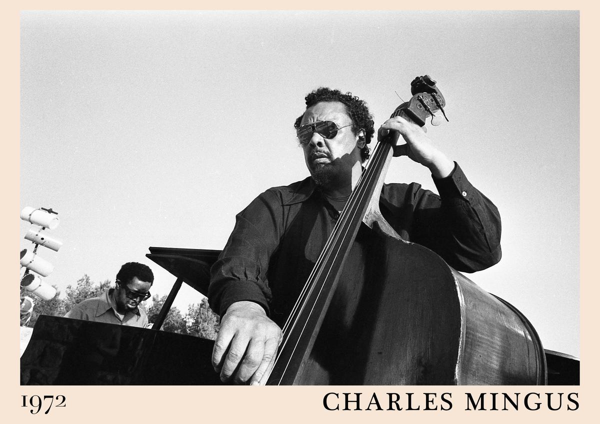 Poster featuring Charles Mingus playing upright bass in 1972, black and white photo with retro border, cool jazz wall art,