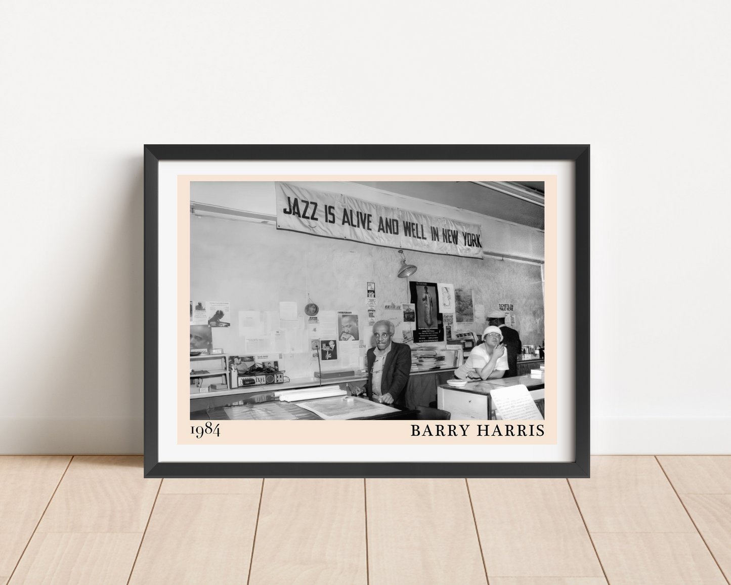 Barry Harris Retro Jazz Poster in landscape main mount mockup, black frame on wood floor, vintage 1984 jazz scene design