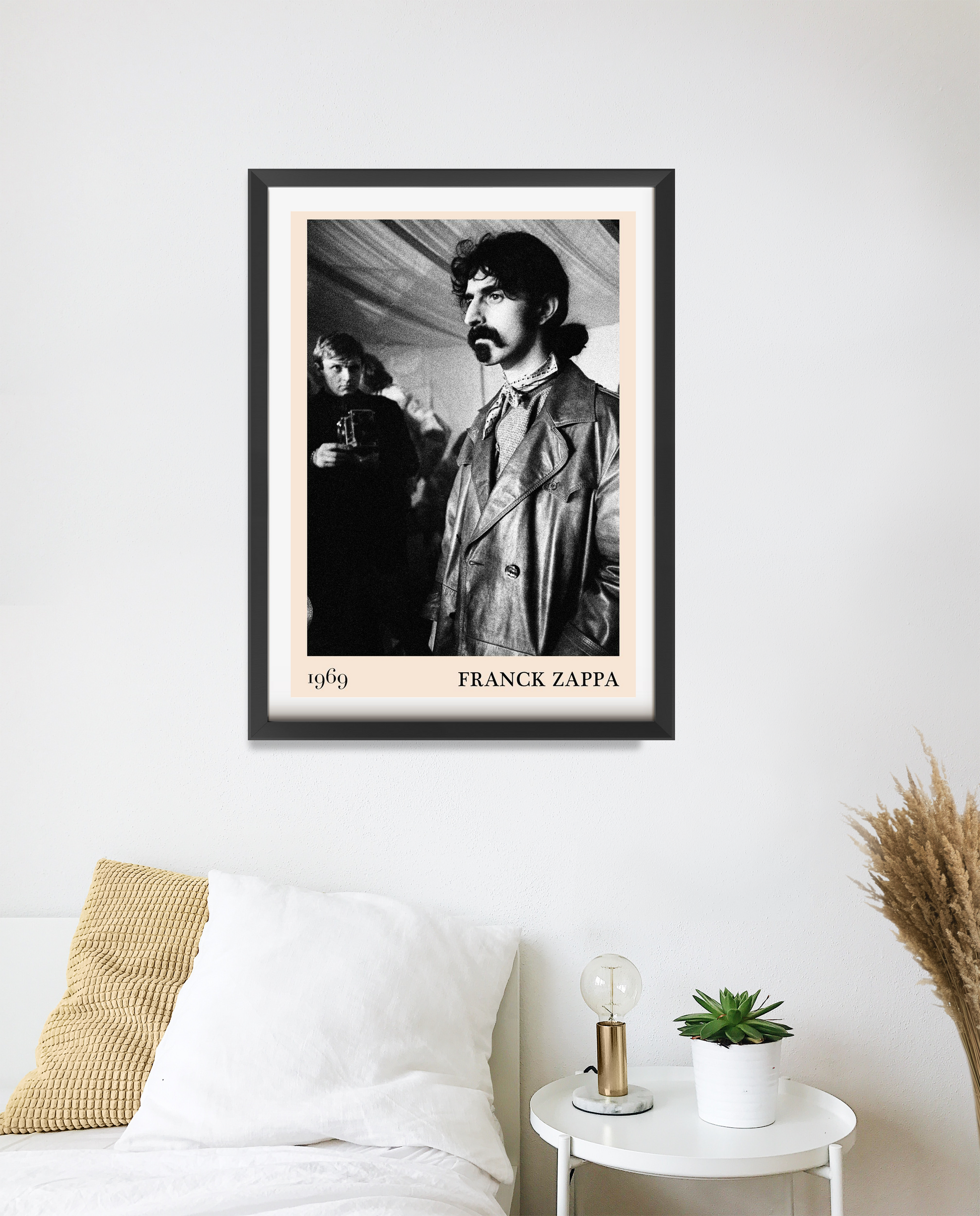Franck Zappa Retro Concert Poster in portrait 20 mount mockup, black and white vintage design above modern white bed decor.
