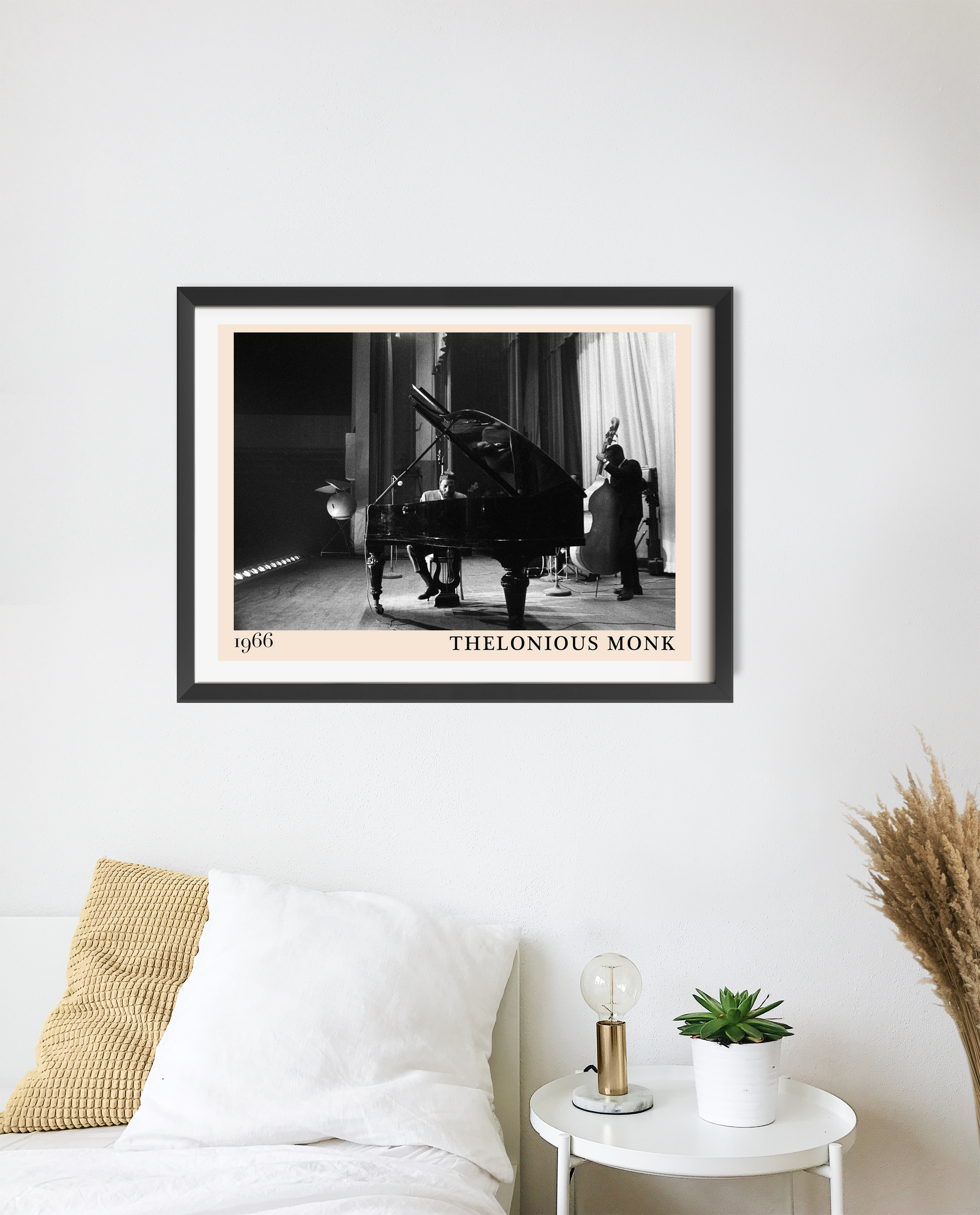 Thelonious Monk vintage jazz poster in a black frame, landscape 20 mount mockup above a modern white bed and nightstand.