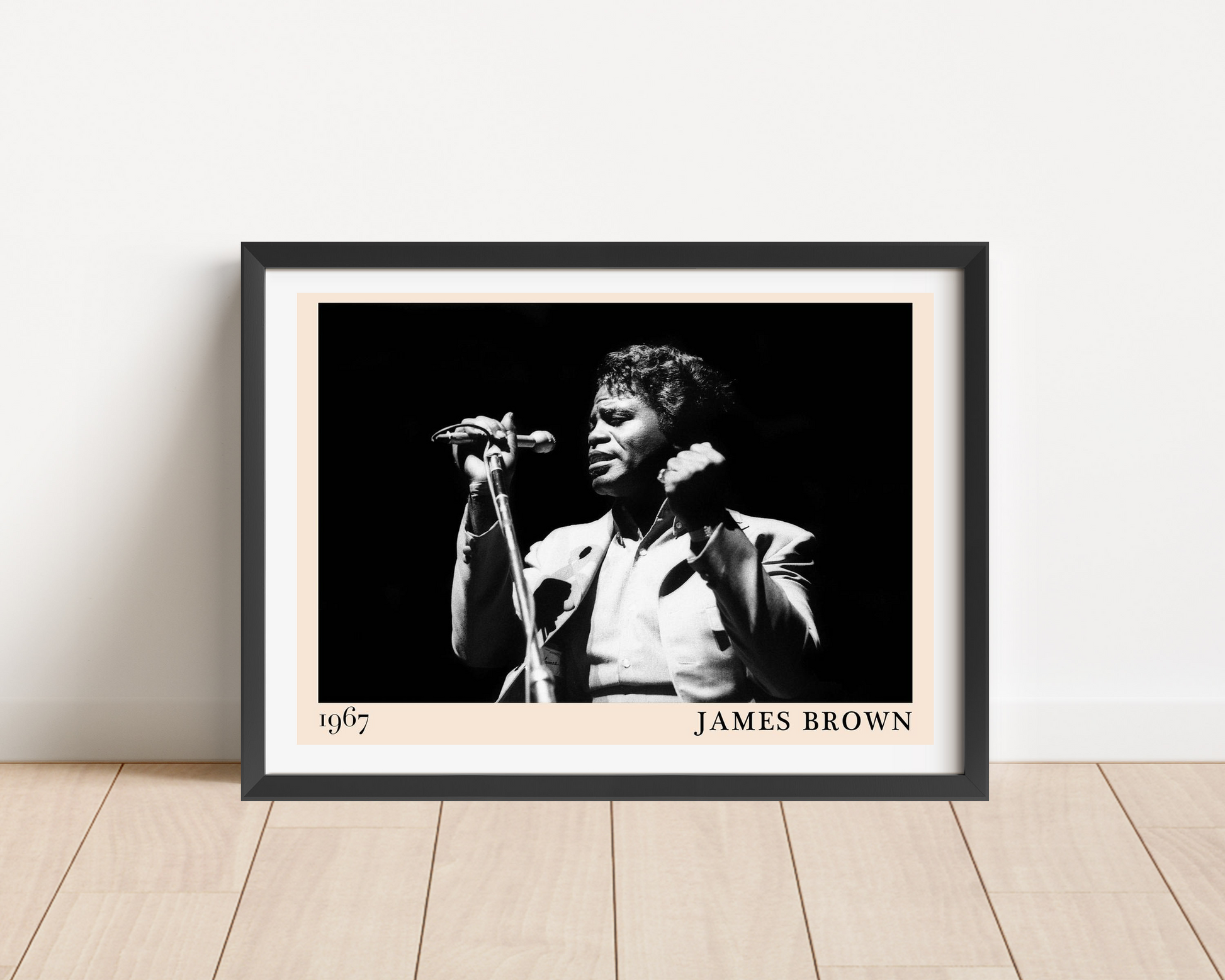 James Brown Retro Soul Poster in landscape mount mockup, black and white portrait design framed on a wooden floor against wal