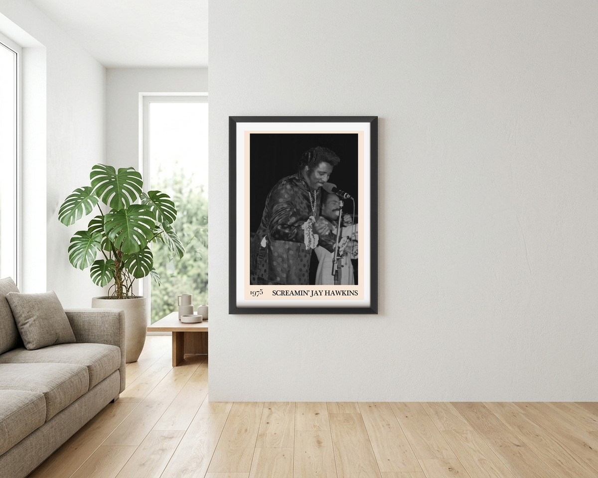 Framed print of Screamin Jay Hawkins performing live in 1975, displayed on a white wall in a bright modern living room.