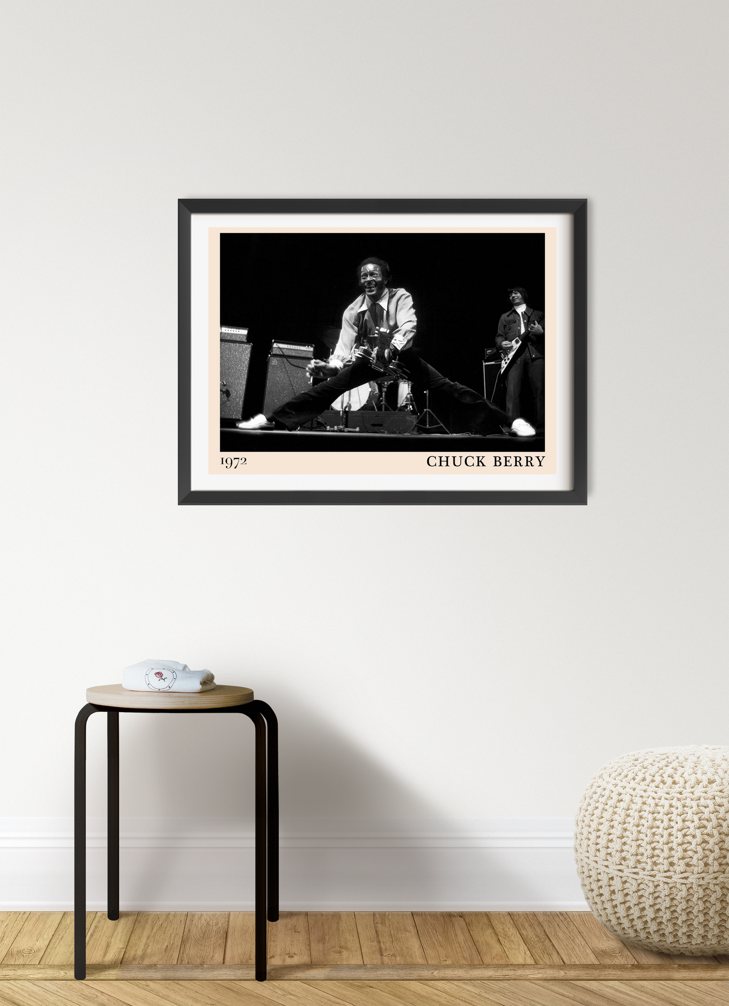 Chuck Berry Retro Rock Poster in landscape mount mockup, black and white concert photo above minimalist stool and pouf.