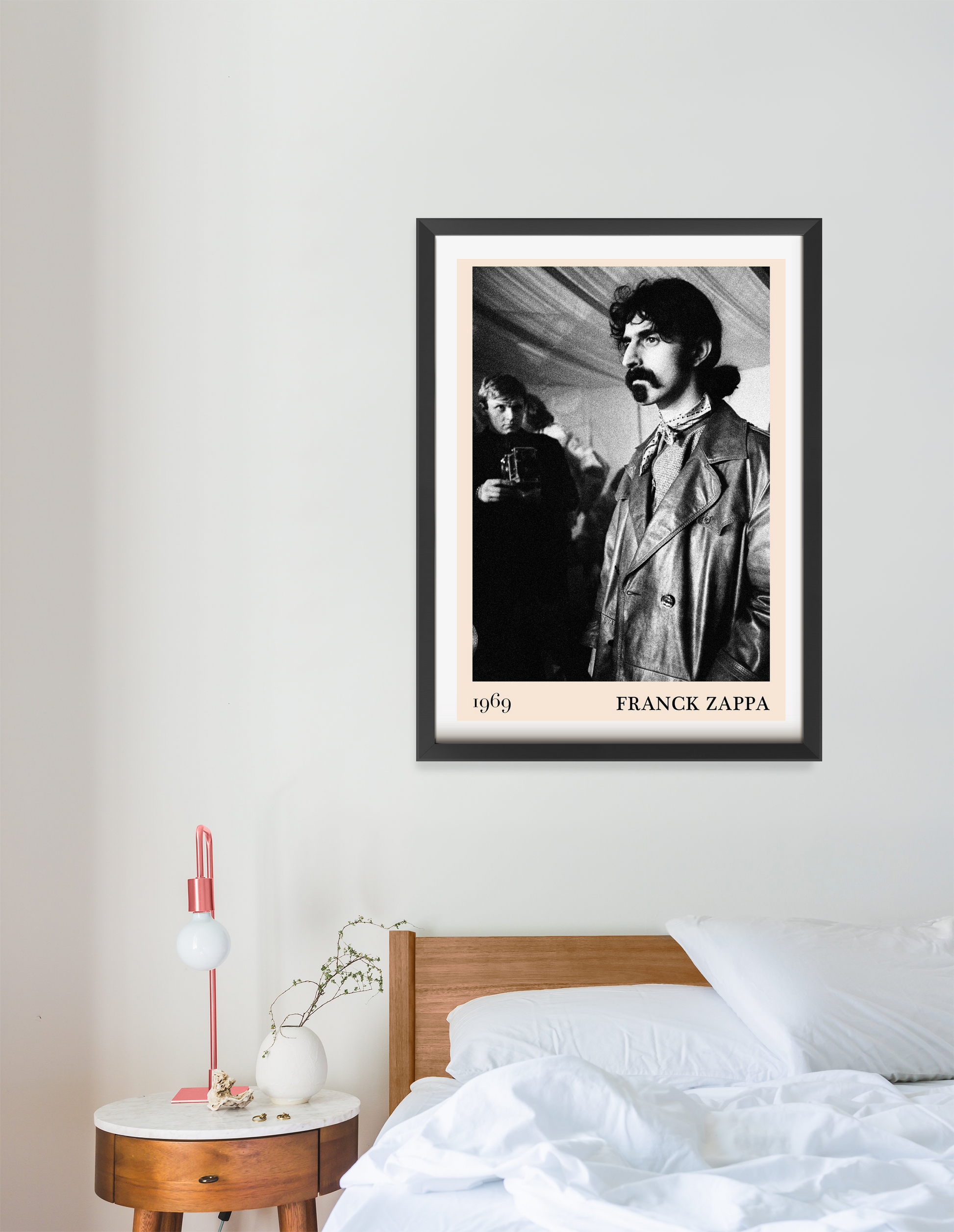 Franck Zappa Retro Concert Poster in portrait 16 mount mockup above a modern wooden bed, black and white vintage design.