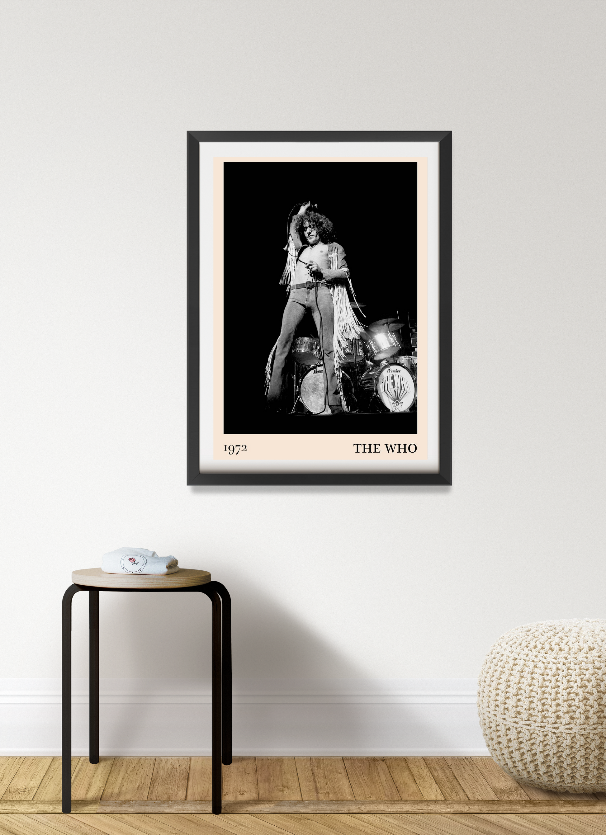 The Who Vintage Concert Poster in portrait 7 mount mockup, black and white design hangs above a modern stool and pouf.
