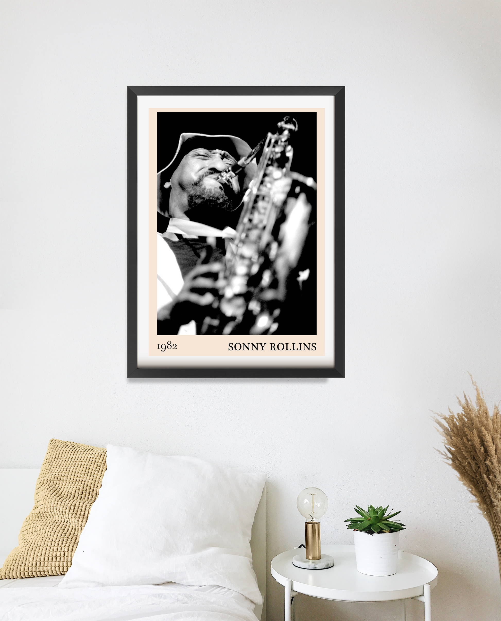 Sonny Rollins Jazz Concert Poster in portrait 20 mount mockup, black and white saxophone design above a cozy bed setup.