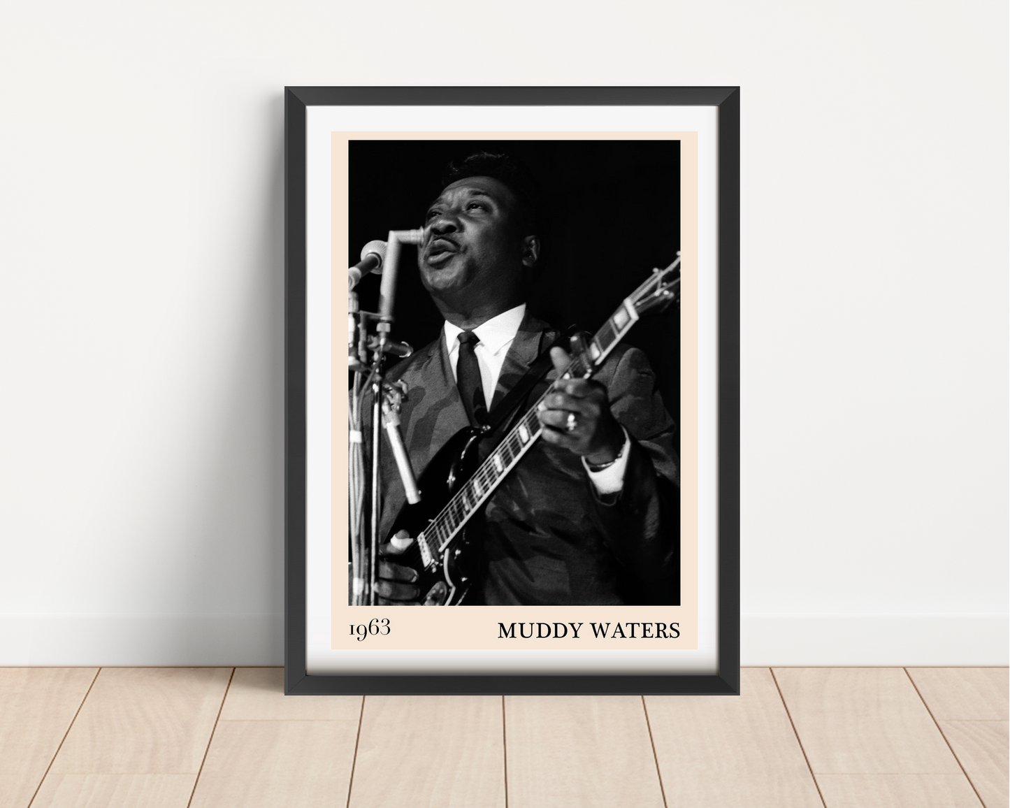 Muddy Water Blues concert poster in portrait main mount mockup, black frame on wood floor, vintage photo design, 1963 text.