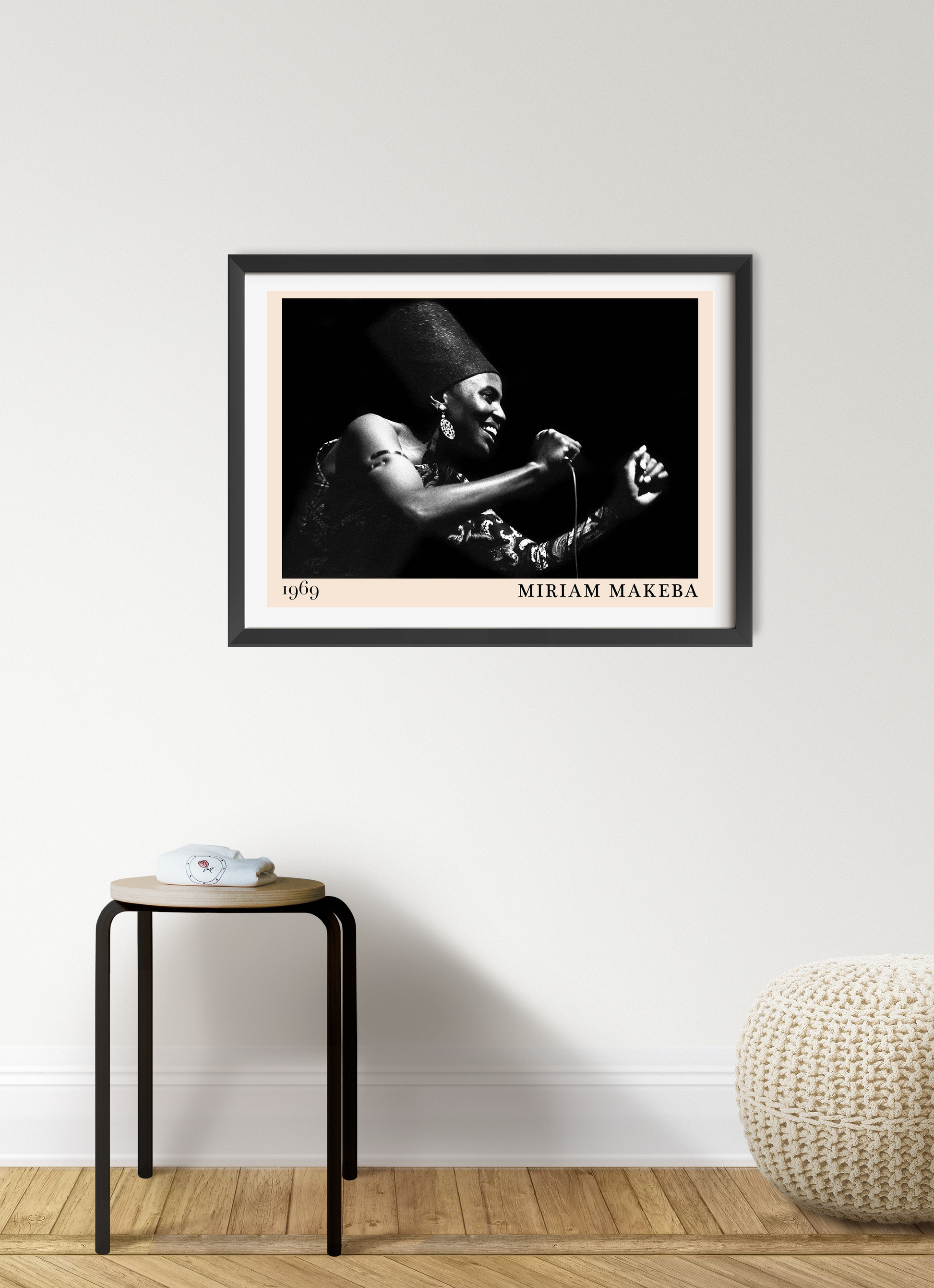 Miriam Makeba Jazz Concert Poster in landscape mount mockup, black and white design framed on modern living room wall.
