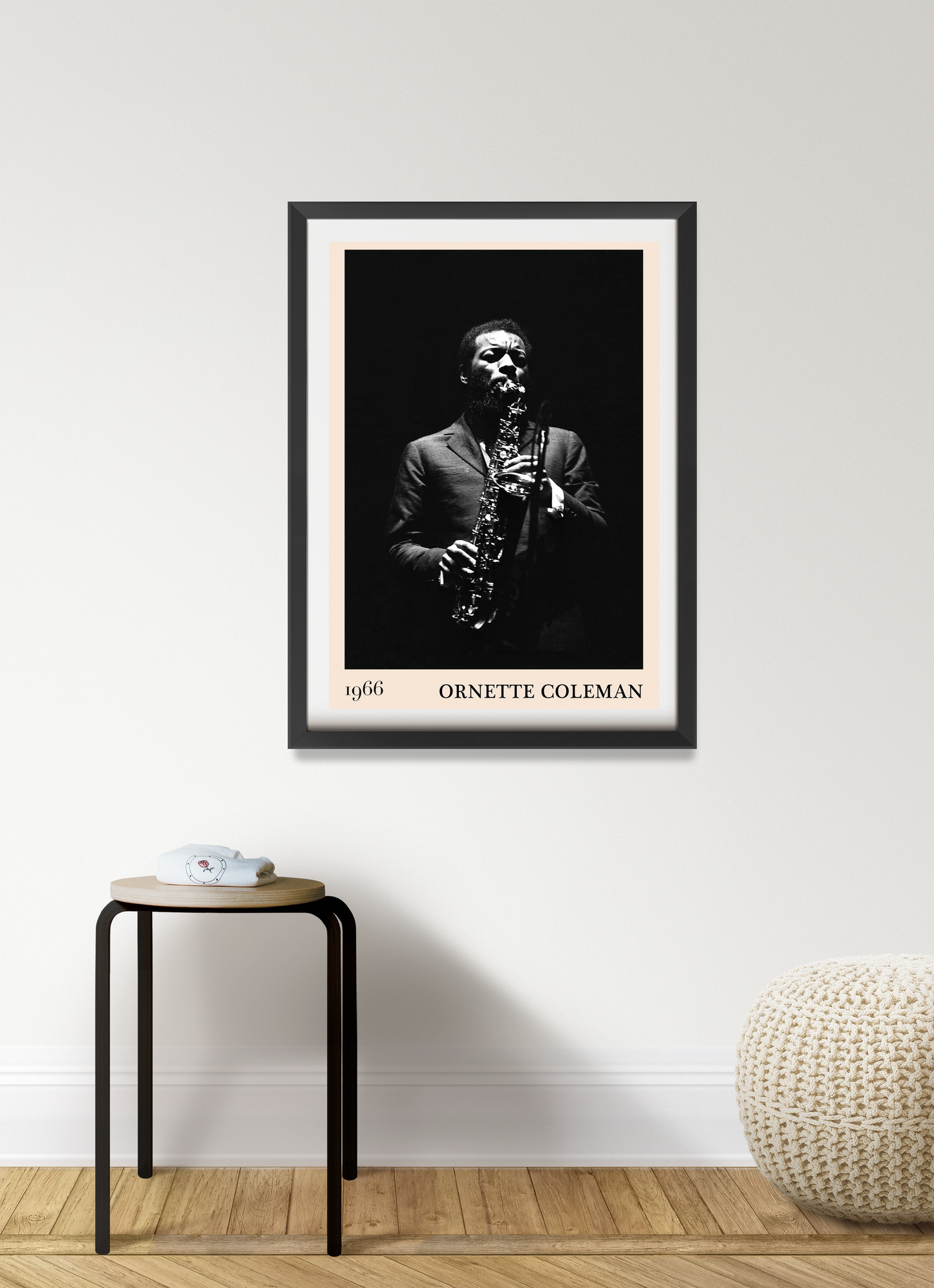 Ornette Coleman vintage jazz poster in portrait 7 mount mockup, black-and-white saxophone print above modern stool.
