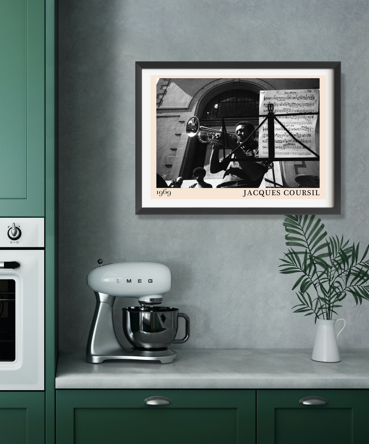 Jacques Coursil vintage jazz poster in landscape mount displayed above a kitchen counter with mixer and vase on a gray wall.