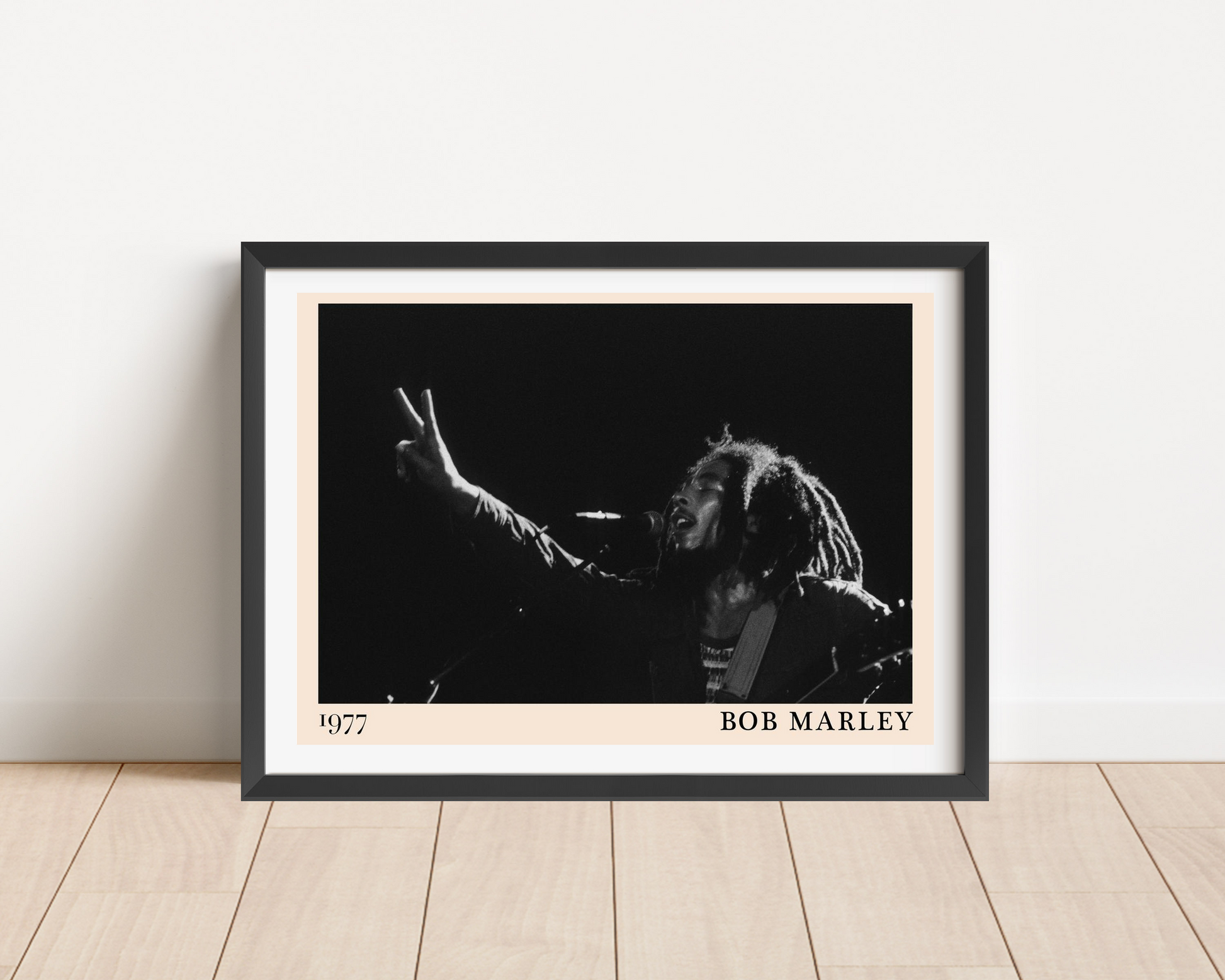 Bob Marley Iconic Peace Poster in landscape mount mockup, black-and-white portrait with peace sign, modern wood floor display