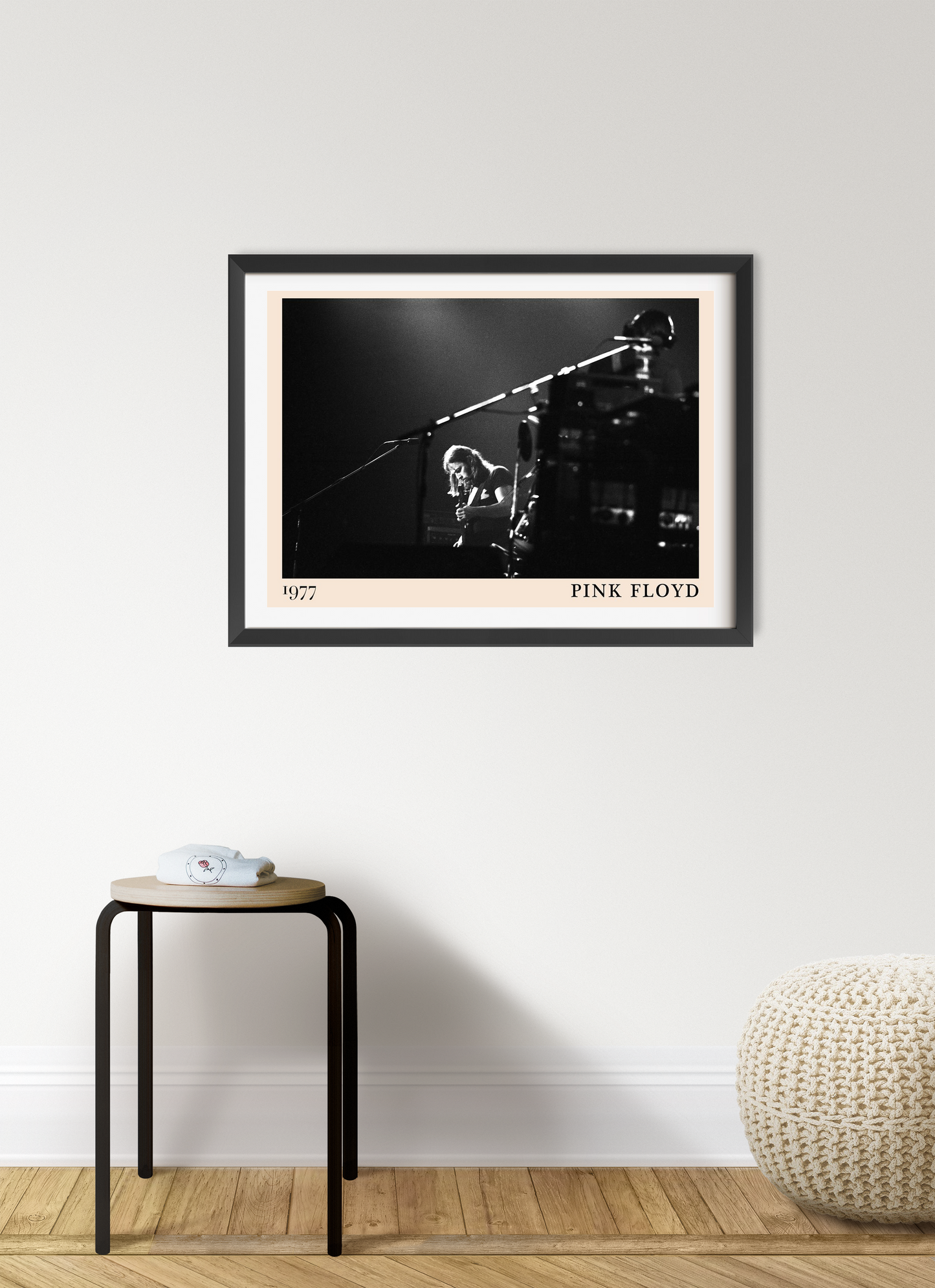 Pink Floyd rock concert poster in landscape 7 mount mockup, black and white stage photo, framed on modern wall.
