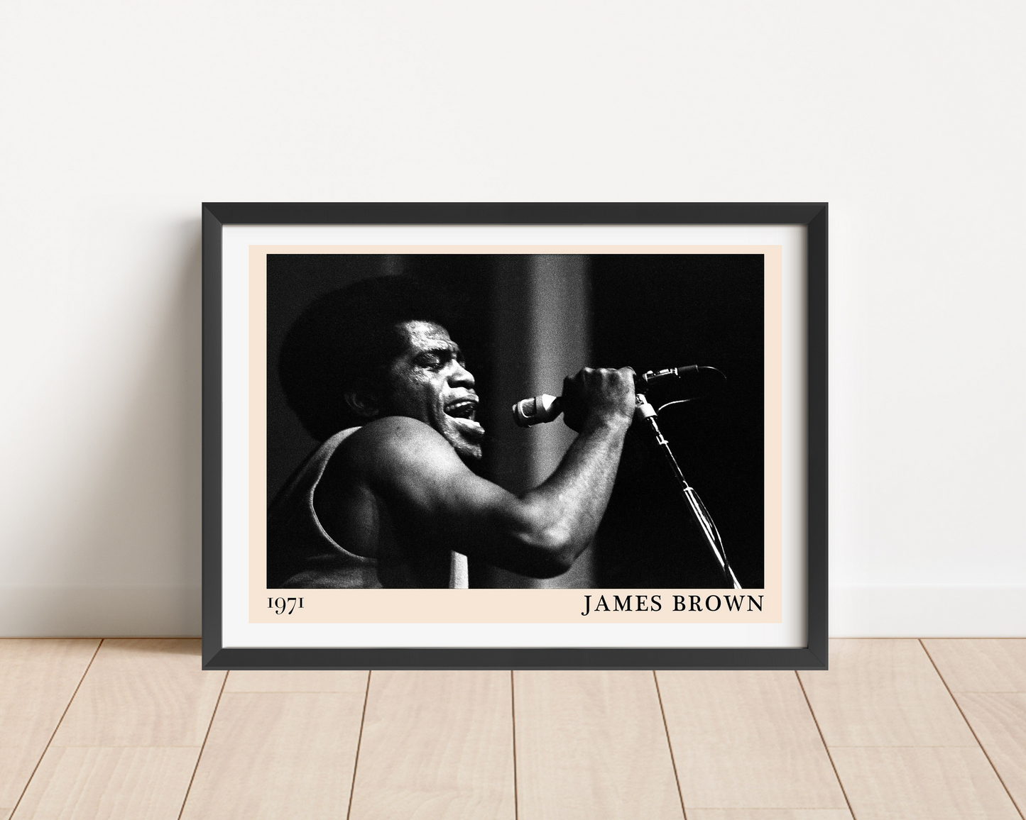James Brown Vintage Soul Poster in landscape main mount mockup, black and white 1971 concert photo framed on wood floor.