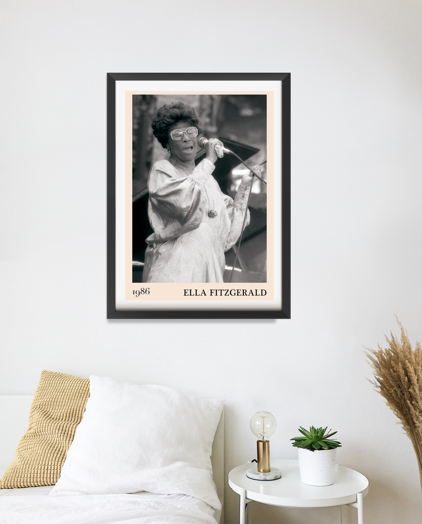 Ella Fitzgerald Retro Jazz Print in a black frame, portrait mount above a modern white bed, monochrome design with 1986 detai