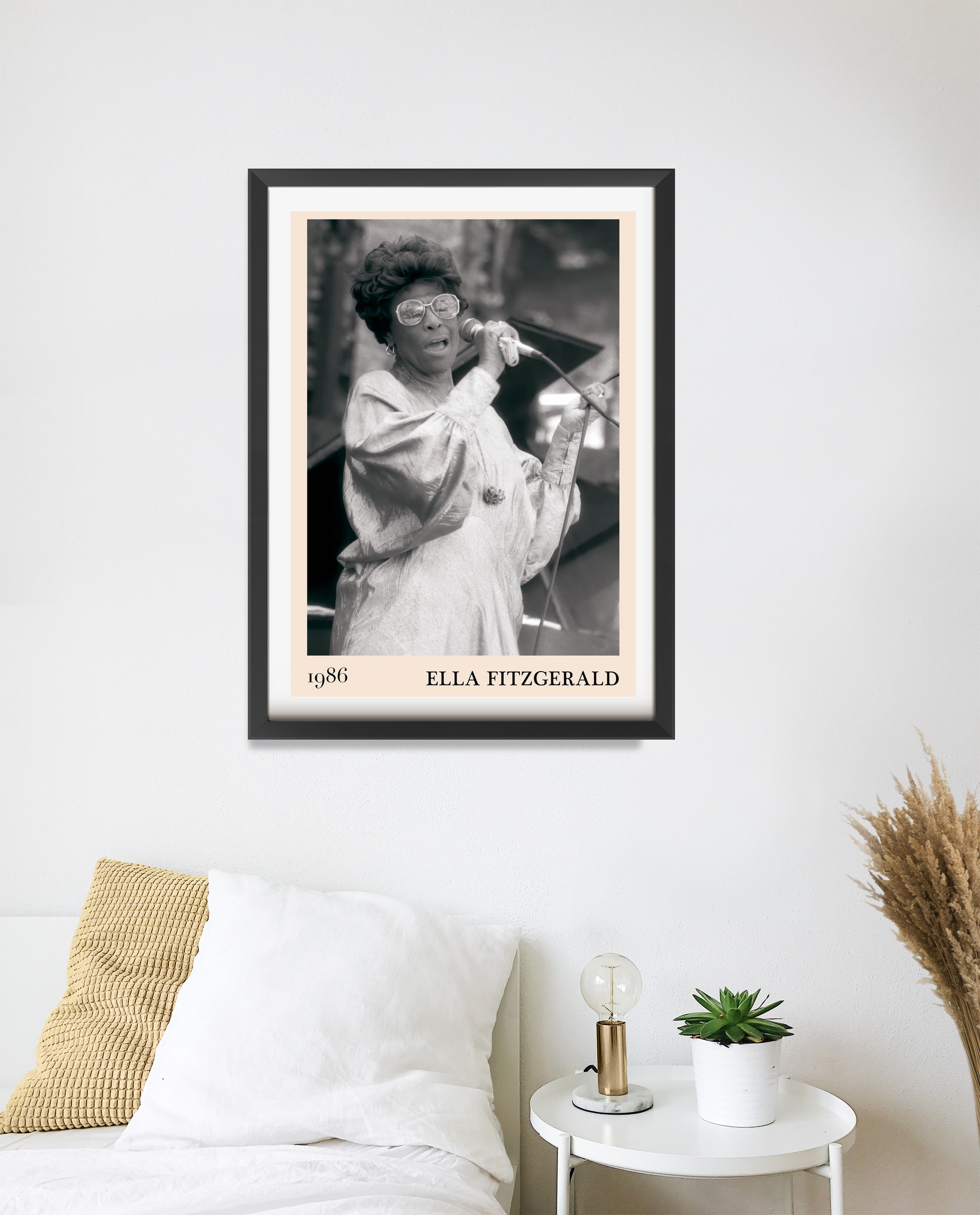 Ella Fitzgerald Retro Jazz Print in a black frame, portrait mount above a modern white bed, monochrome design with 1986 detai