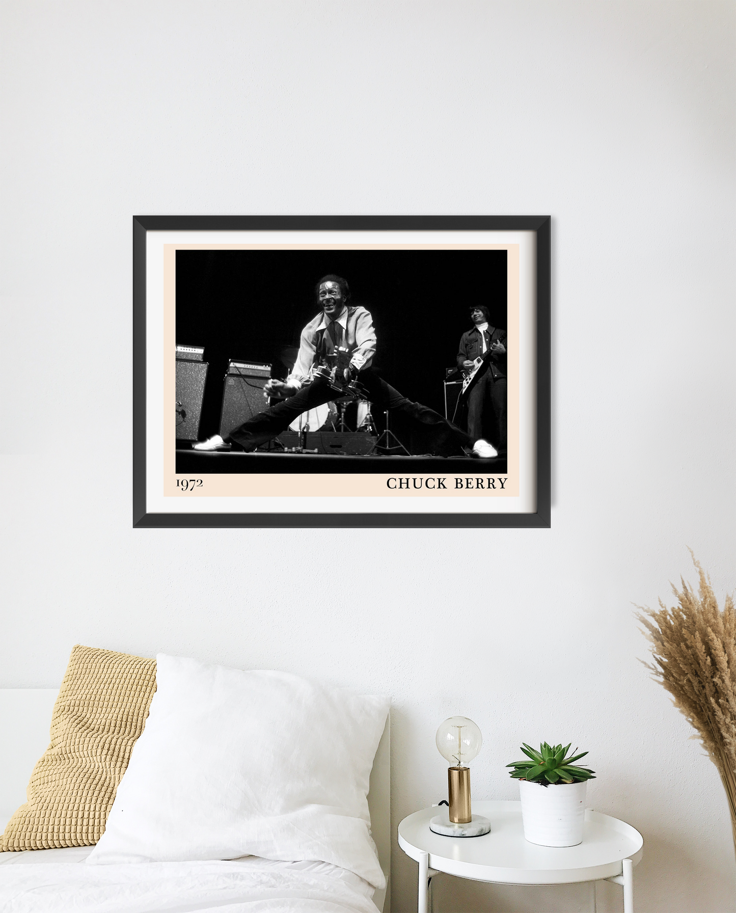 Chuck Berry Retro Rock Poster in landscape mount mockup, black and white concert print framed above modern white bed decor