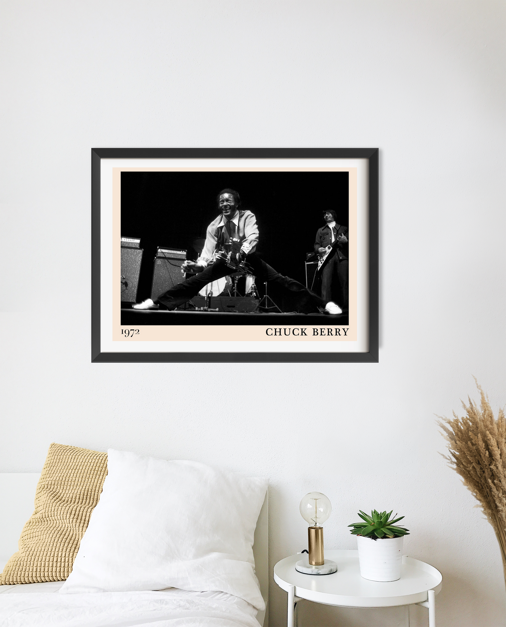 Chuck Berry Retro Rock Poster in landscape mount mockup, black and white concert print framed above modern white bed decor