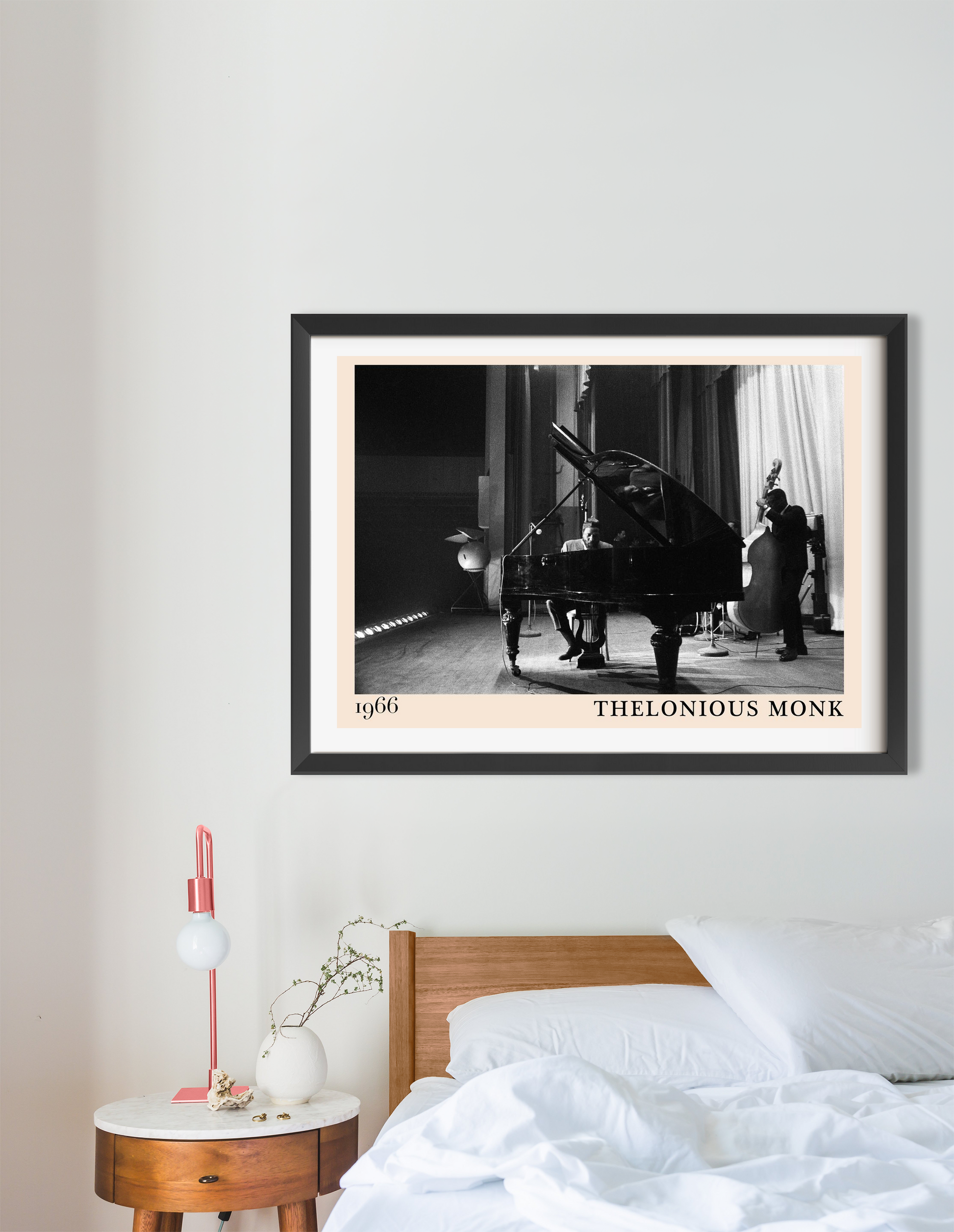 Thelonious Monk vintage jazz poster in a black frame, landscape 16 mount, above a wooden bed in a modern bedroom.