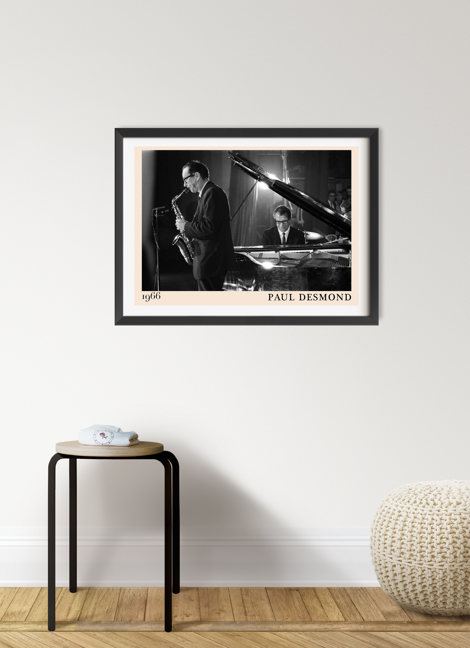 Paul Desmond Retro Jazz Poster in landscape 7 mount mockup, black and white 1966 jazz scene above modern stool and pouf