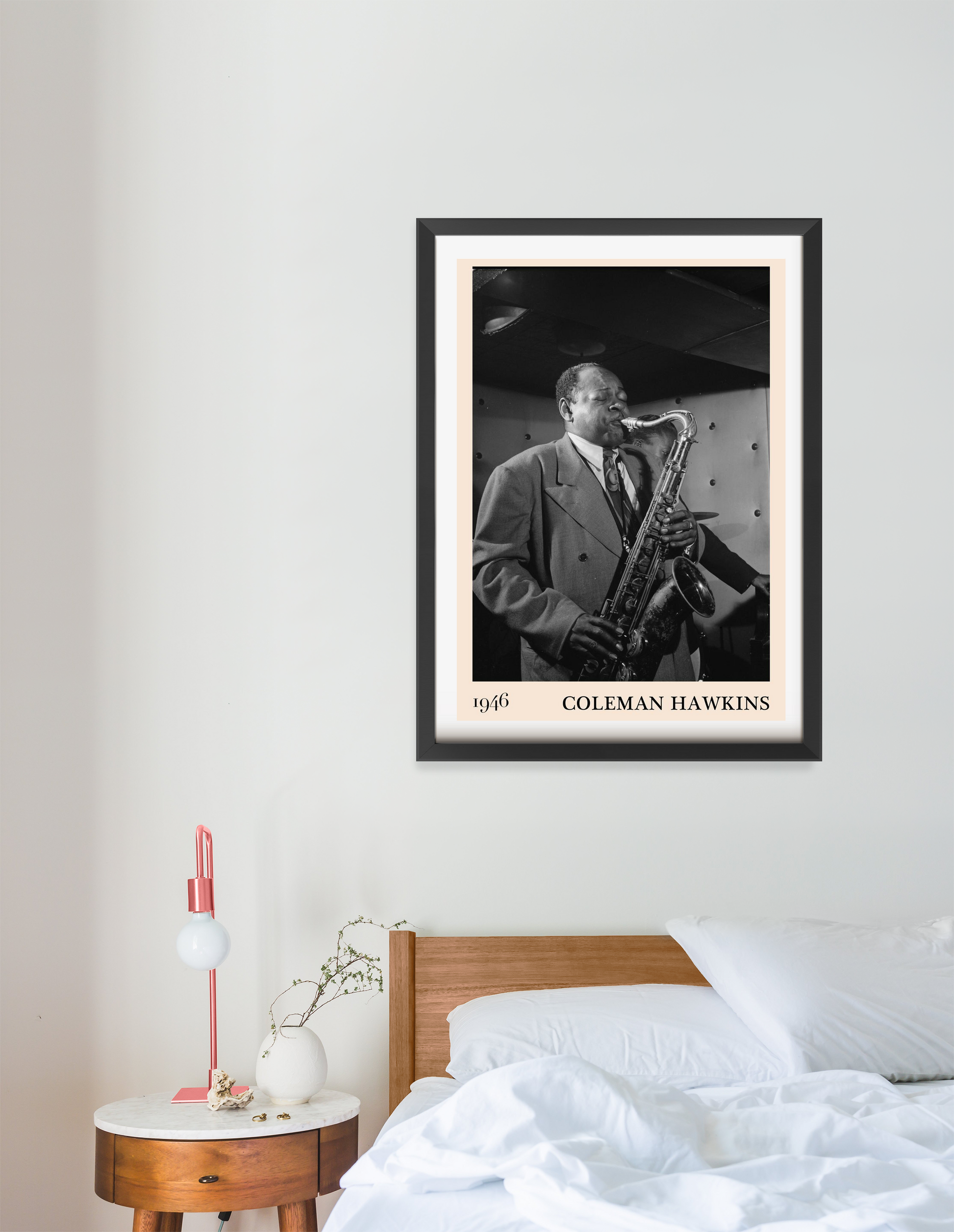 Coleman Hawkins Jazz Concert Poster in black frame, portrait 16 mount above a modern wood bed, minimalist bedroom decor.