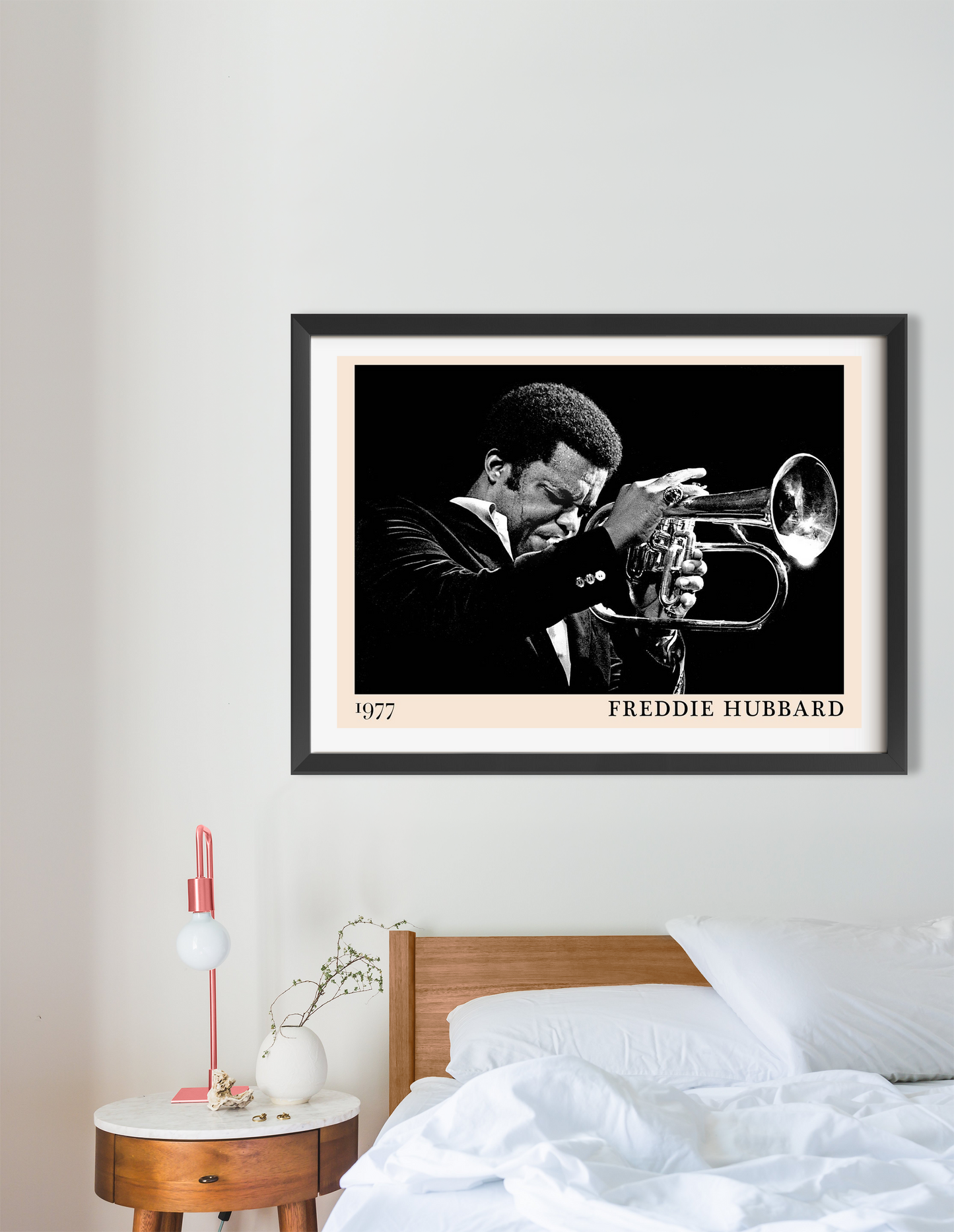 Freddie Hubbard Retro Jazz Print in landscape 16 mount above modern bed, black and white trumpet portrait, minimalist decor.