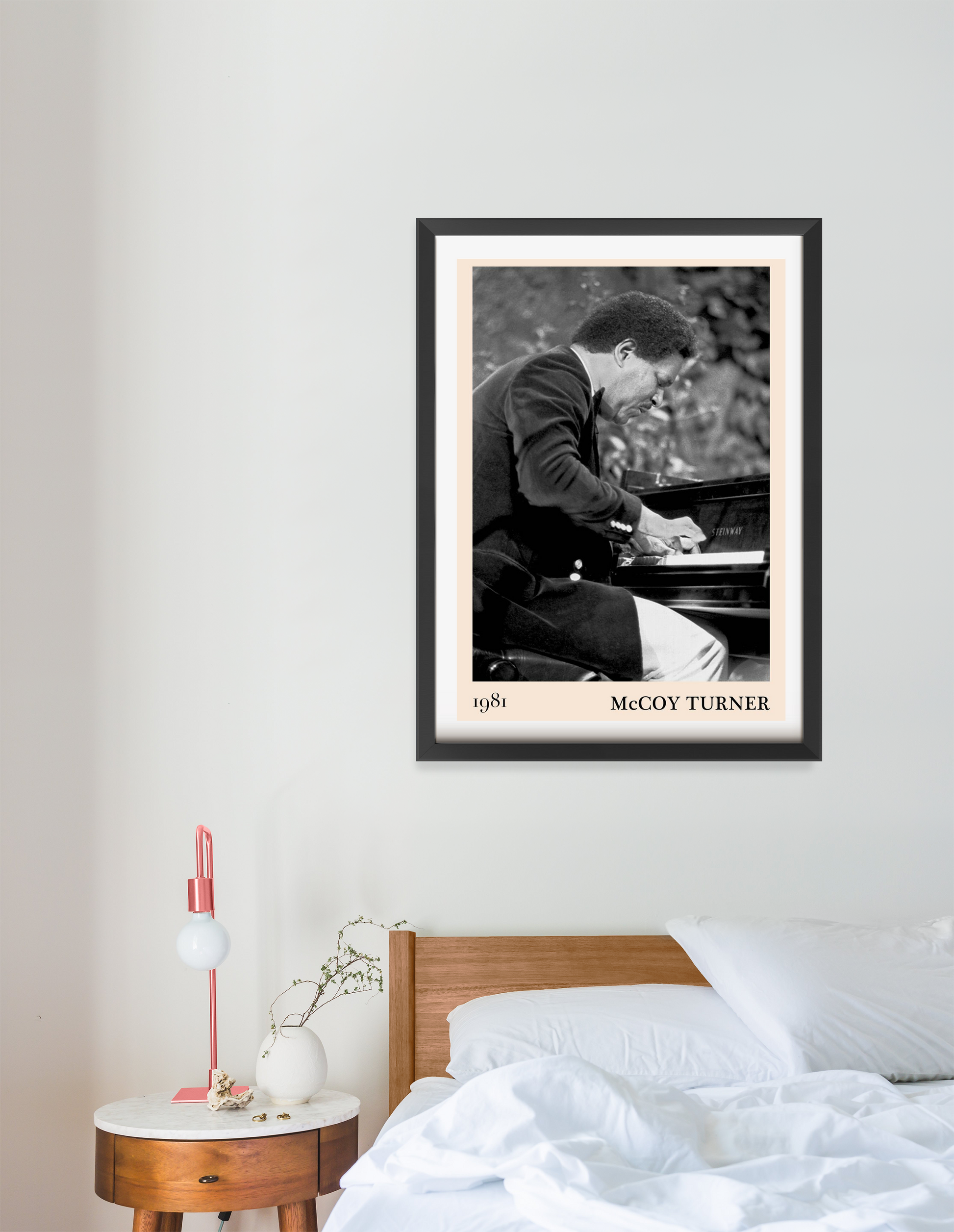 McCoy Turner Jazz Piano Print in portrait 16 mount mockup above a modern wood bed, black and white piano design, cozy bedroom