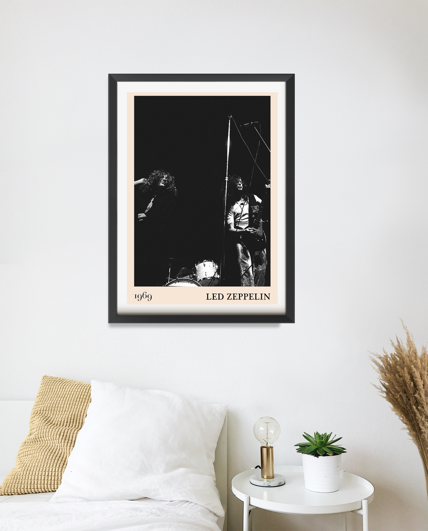 Led Zeppelin vintage rock poster in portrait 20 mount mockup, black and white band photo above bed in modern bedroom decor.