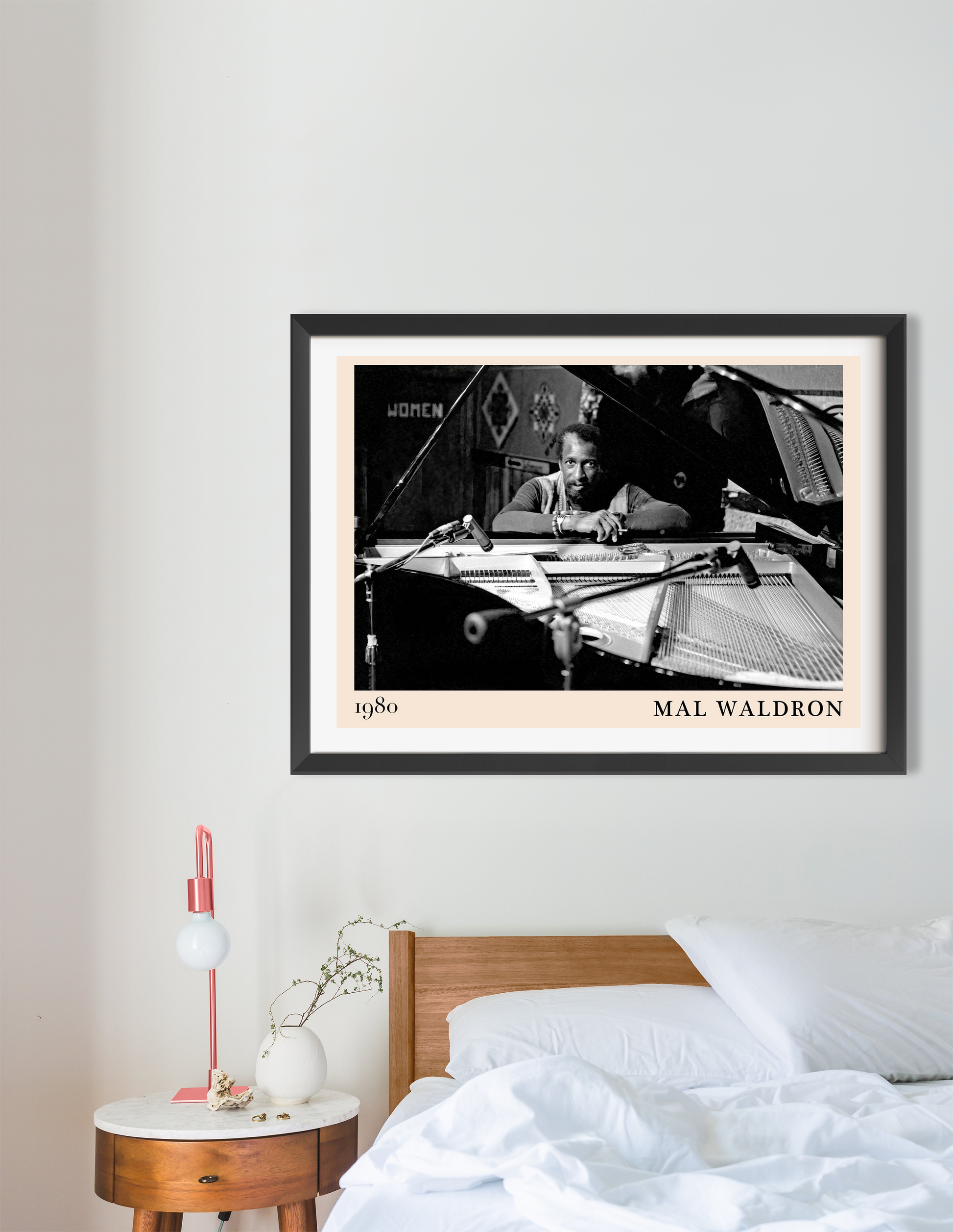 Mal Waldron Jazz Poster in landscape 16 mount mockup, black and white piano portrait above a modern wooden bed in bright room