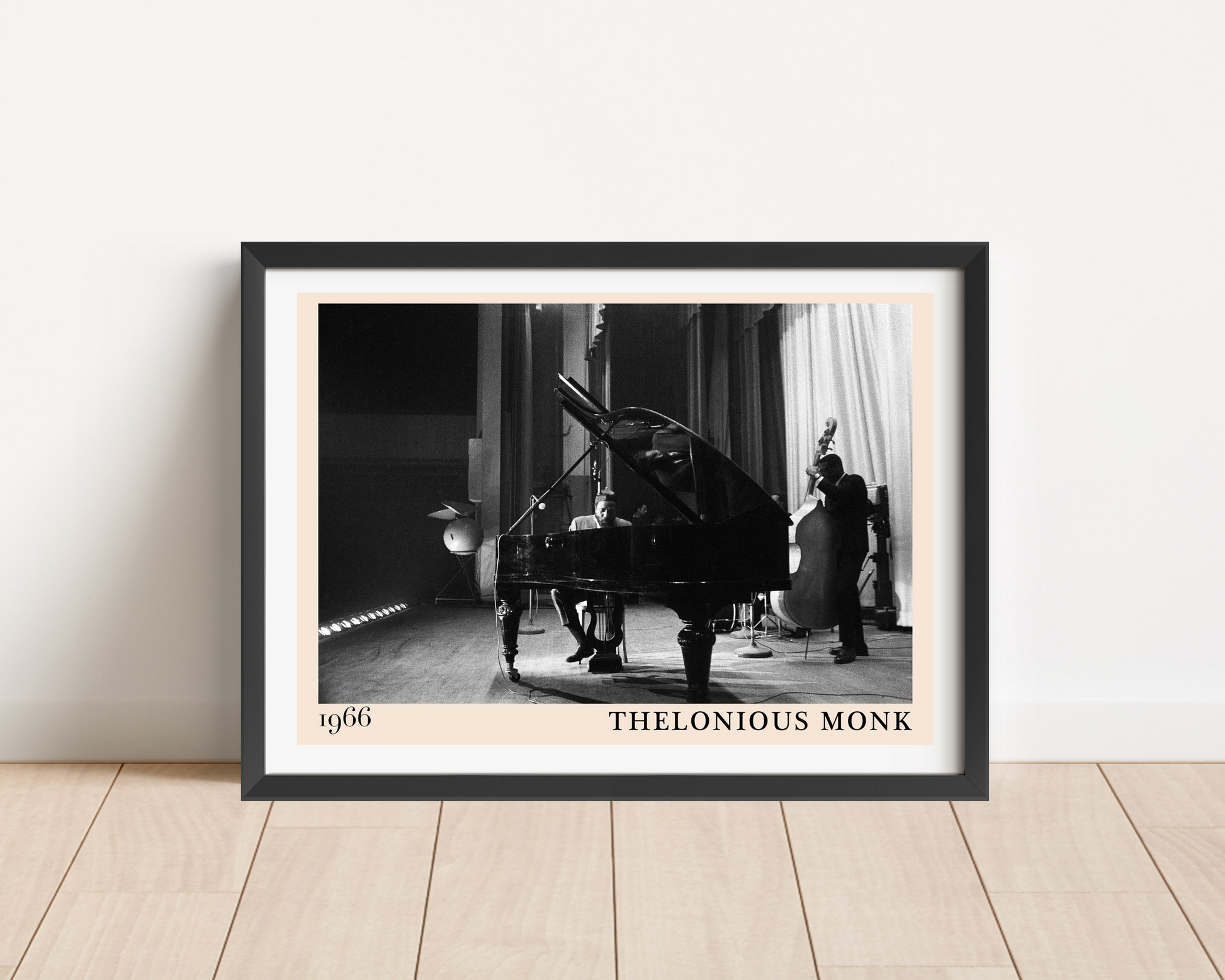 Thelonious Monk vintage jazz poster in landscape mount mockup, black frame on wood floor, classic 1966 concert scene.