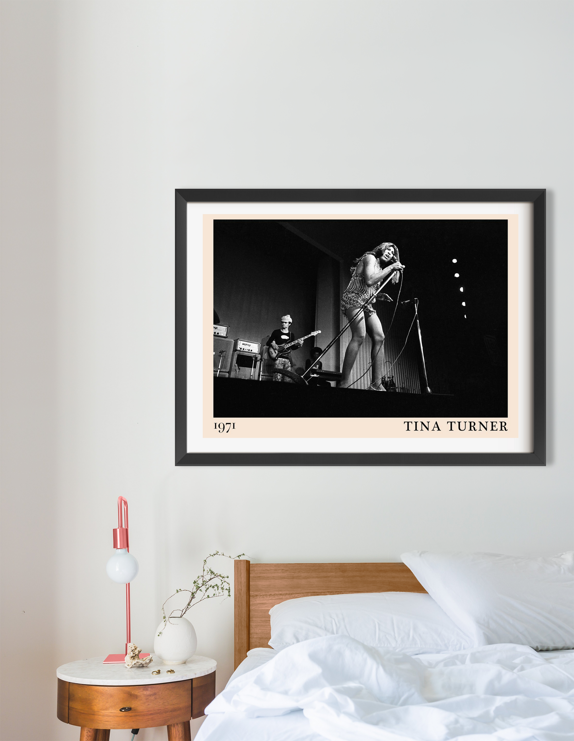 Tina Turner retro concert poster in landscape 16 mount mockup, black and white stage photo above modern bed setup