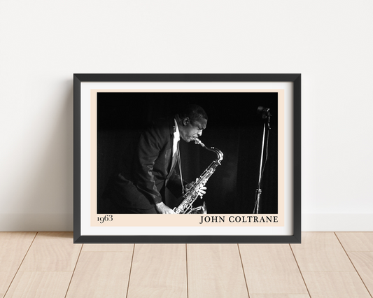 John Coltrane Jazz Concert Poster in landscape mount mockup, black-and-white saxophone design framed on wood floor.