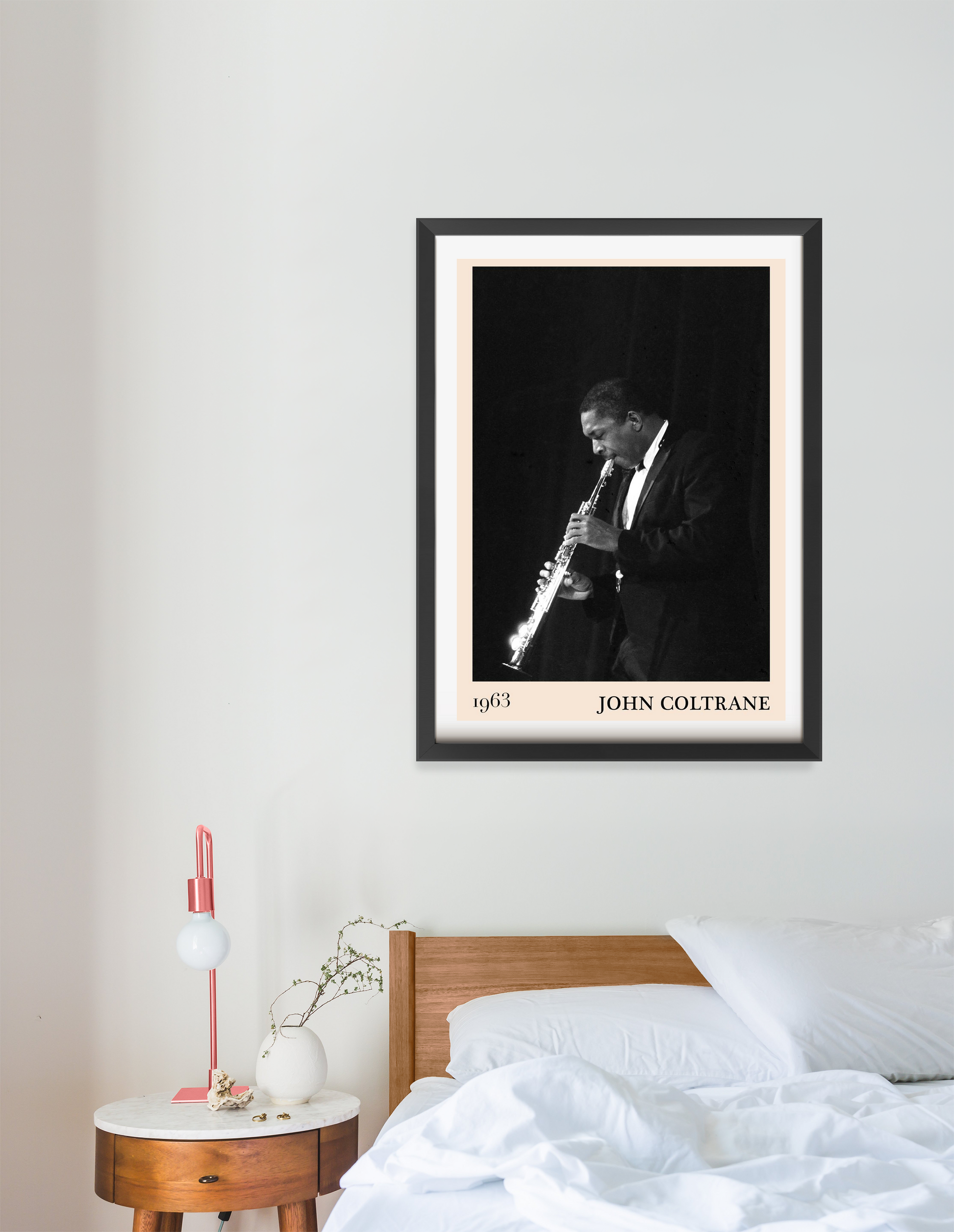 John Coltrane Jazz Poster in portrait 16 mount mockup above a modern wooden bed, black and white saxophone design, bedroom de