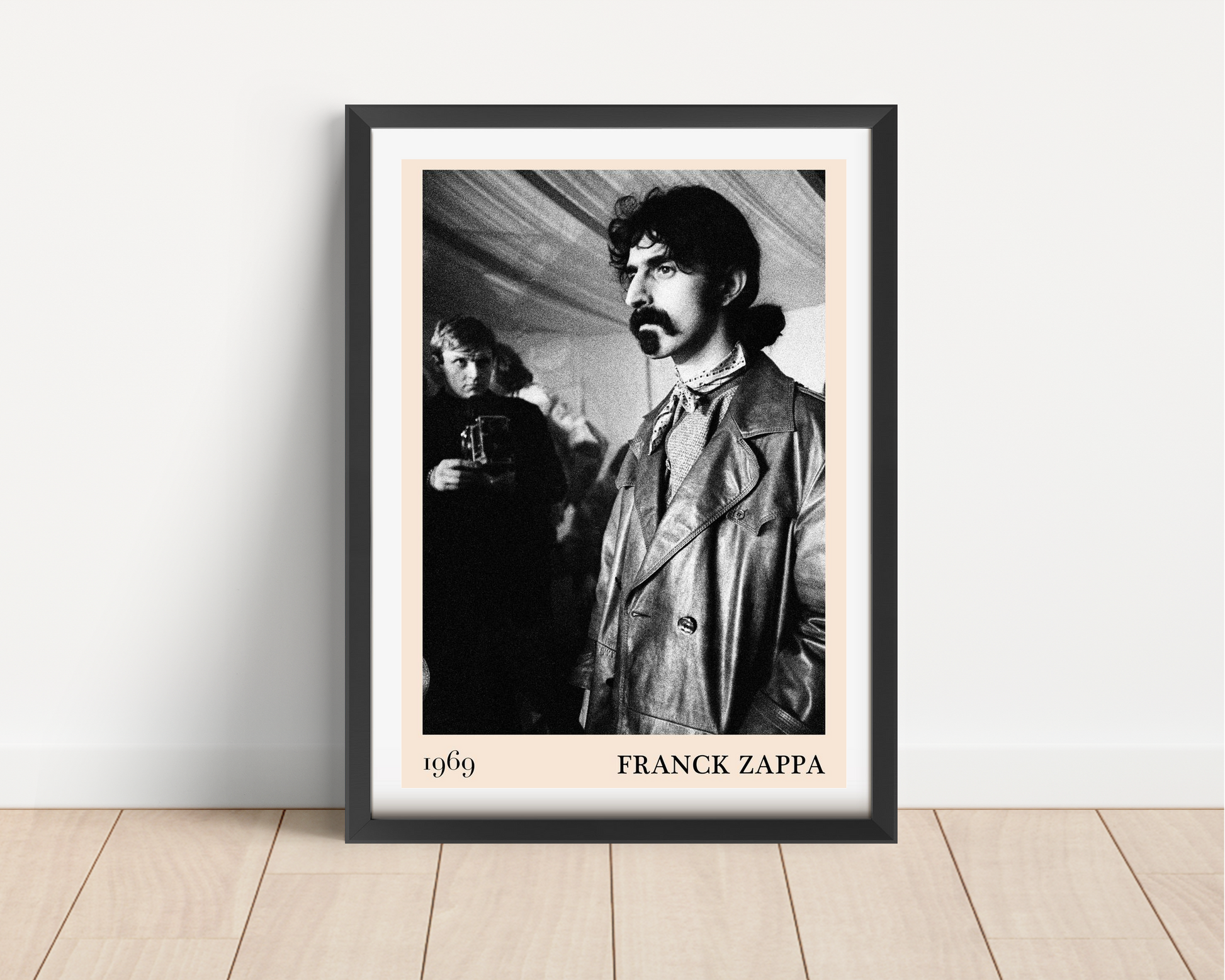Franck Zappa Retro Concert Poster in black frame on wooden floor, vintage black and white portrait, 1969 minimalist design