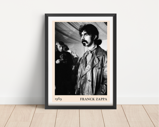 Franck Zappa Retro Concert Poster in black frame on wooden floor, vintage black and white portrait, 1969 minimalist design