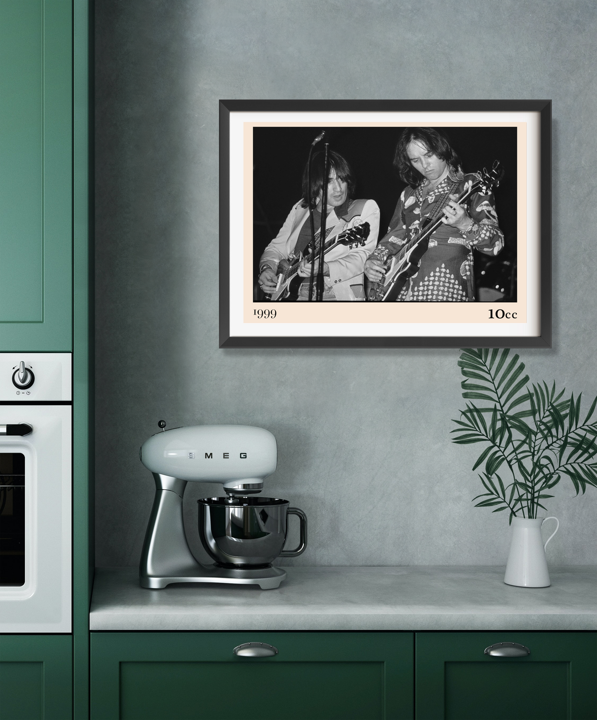 Framed 10cc rock concert print in black and white, dated 1999, displayed above a kitchen worktop with a Smeg stand mixer