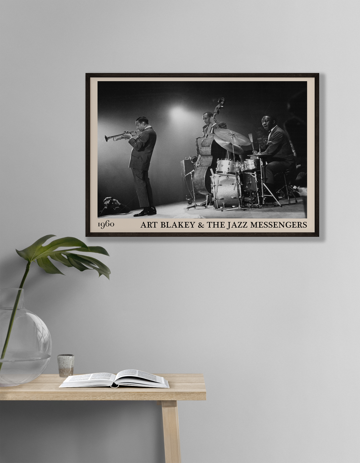 1960 framed jazz poster of Art Blakey & The Jazz Messengers hanging on a grey living room wall
