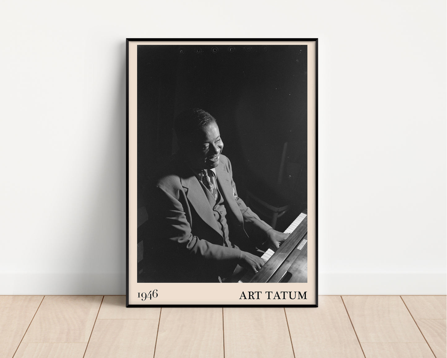 1946 photograph of Art Tatum crafted into a framed jazz poster. The poster has an off-white border and a thin black frame. The poster is resting against a white wall.