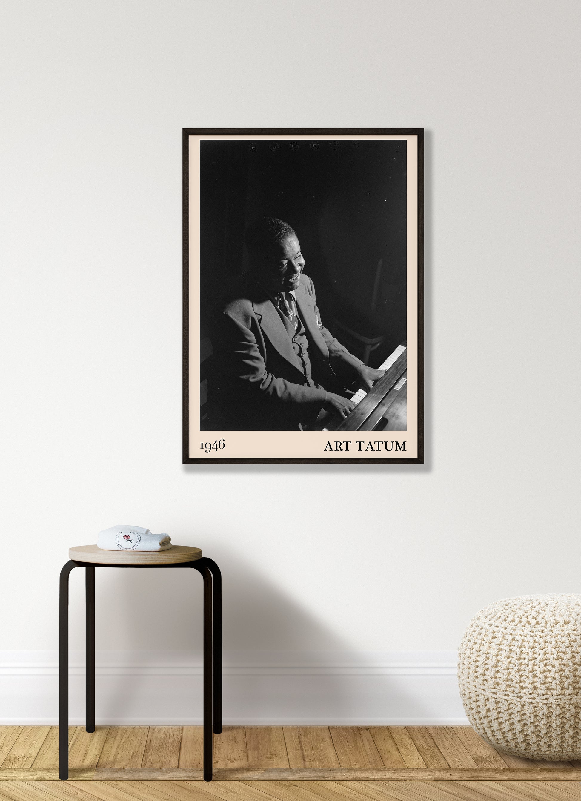 1946 photograph of Art Tatum crafted into a cool framed music print. The poster has an off-white border and a thin black frame. The poster is hanging on a white bedroom wall