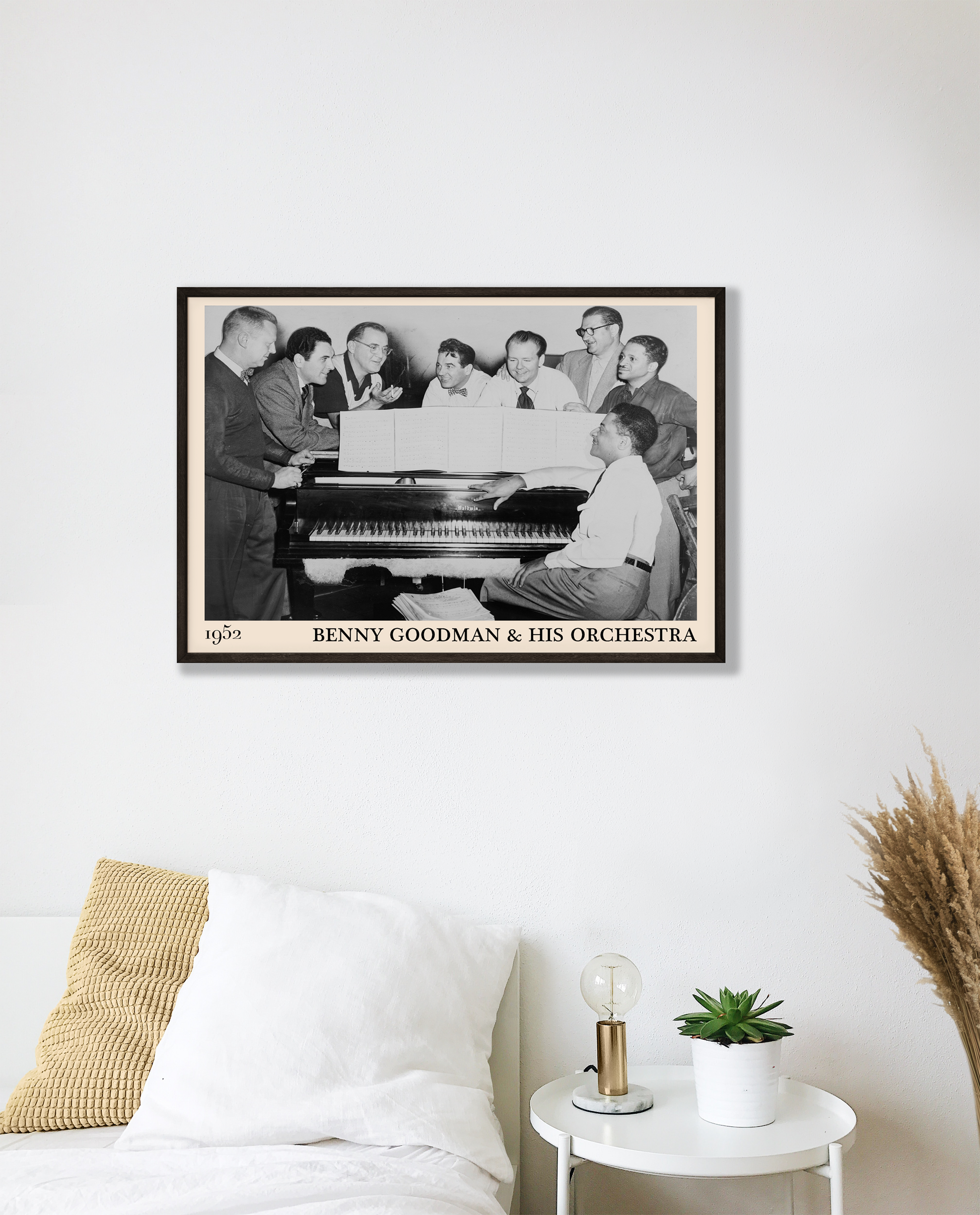 1952 photograph of Benny Goodman & his orchestra crafted into a cool black framed jazz print. The poster is hanging on a white living bedroom wall.