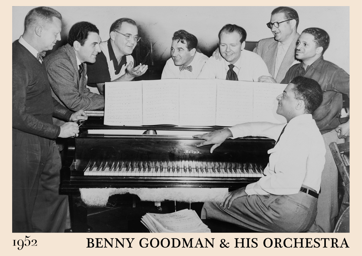 1952 photograph of Benny Goodman & his orchestra crafted into a black framed poster. The poster is resting on a white living room wall.