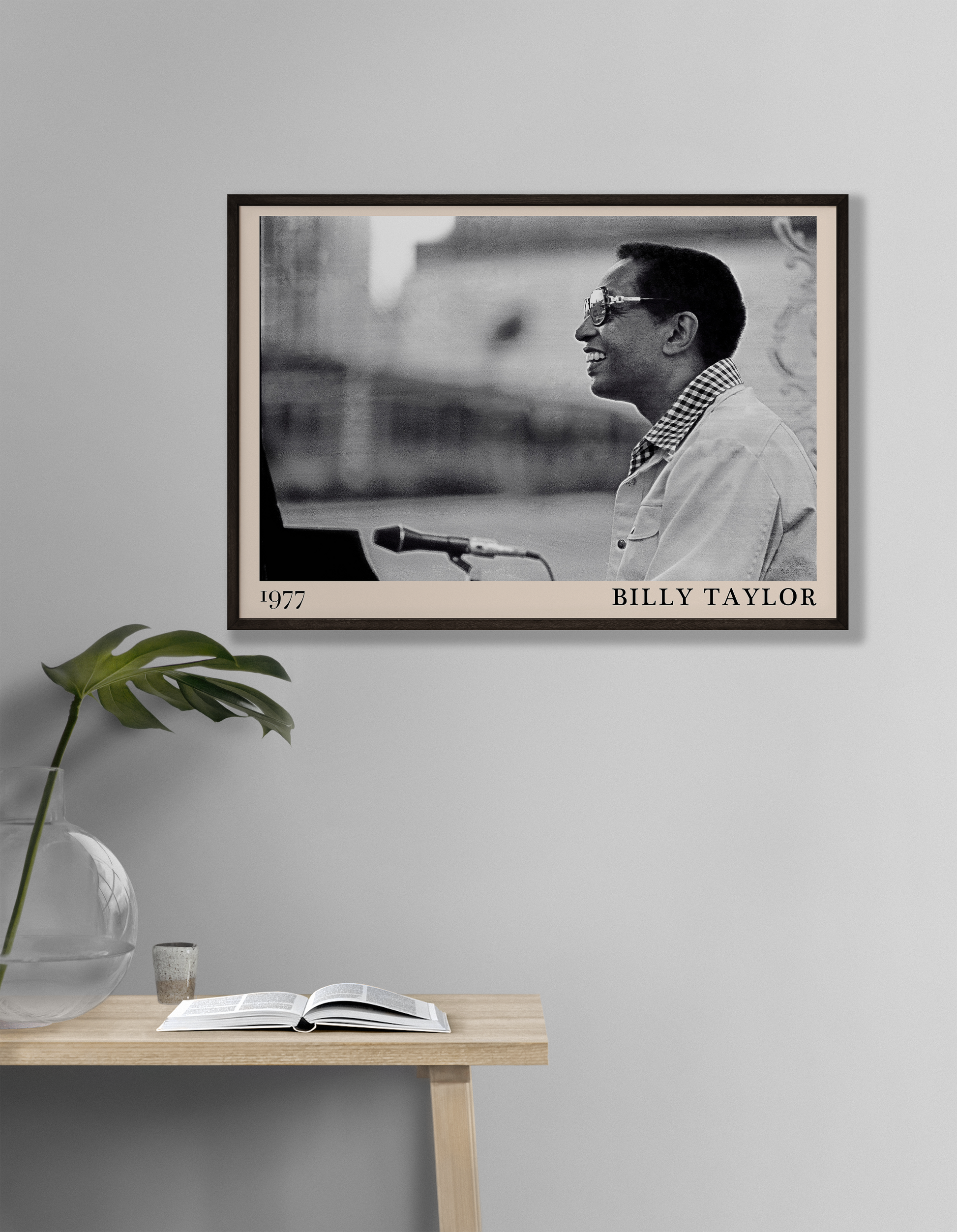 1977 photograph of Billy Taylor taken by Thomas Marcello. Picture crafted into a cool black framed jazz print, with an off-white border. Poster is hanging on a off-white living room wall