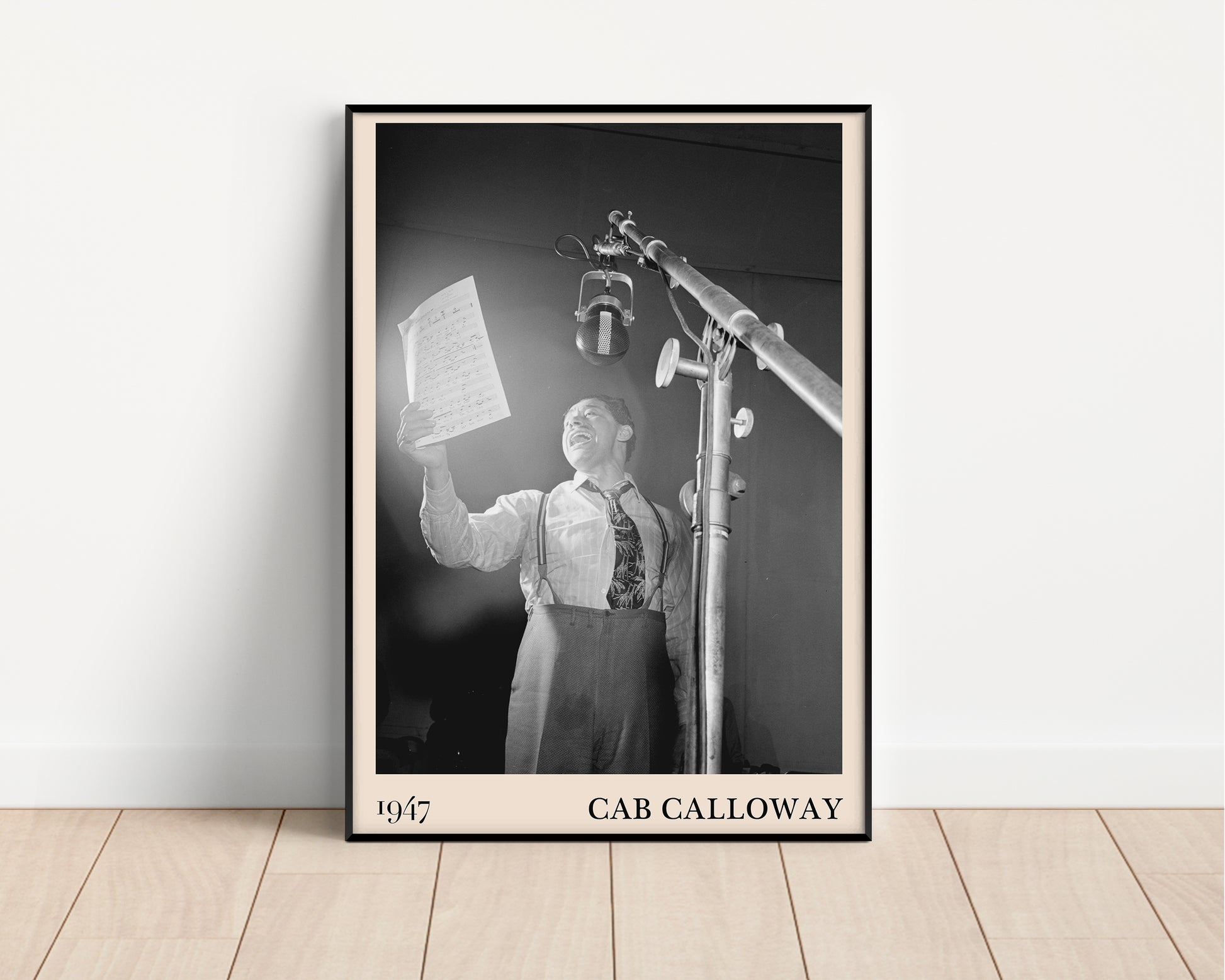 Vintage 1947 photo of Cab Calloway crafted into  black framed poster, resting on a white wall