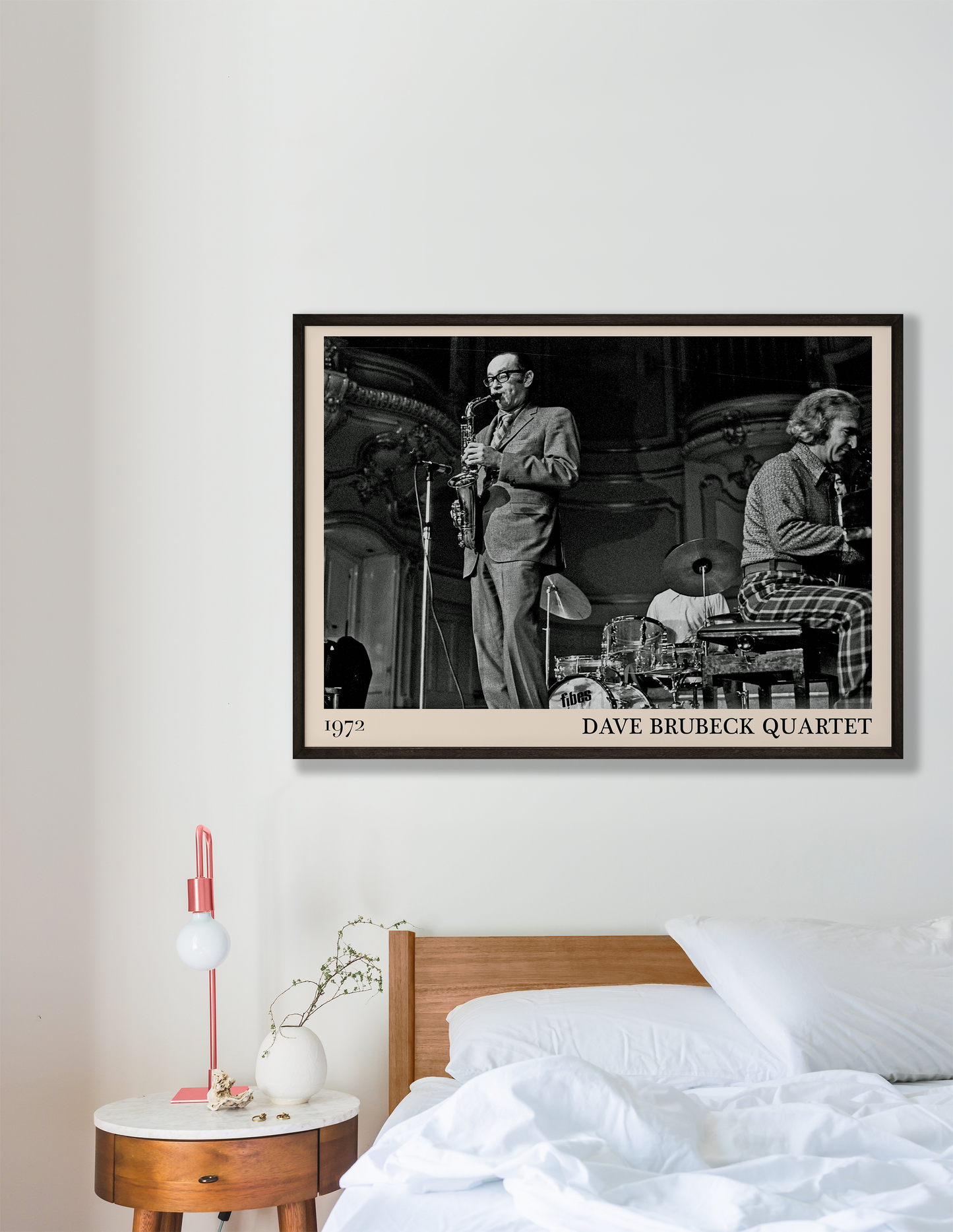 1972 photo of the Dave Brubeck Quartet crafted into a black framed-poster, hanging on a white bedroom wall