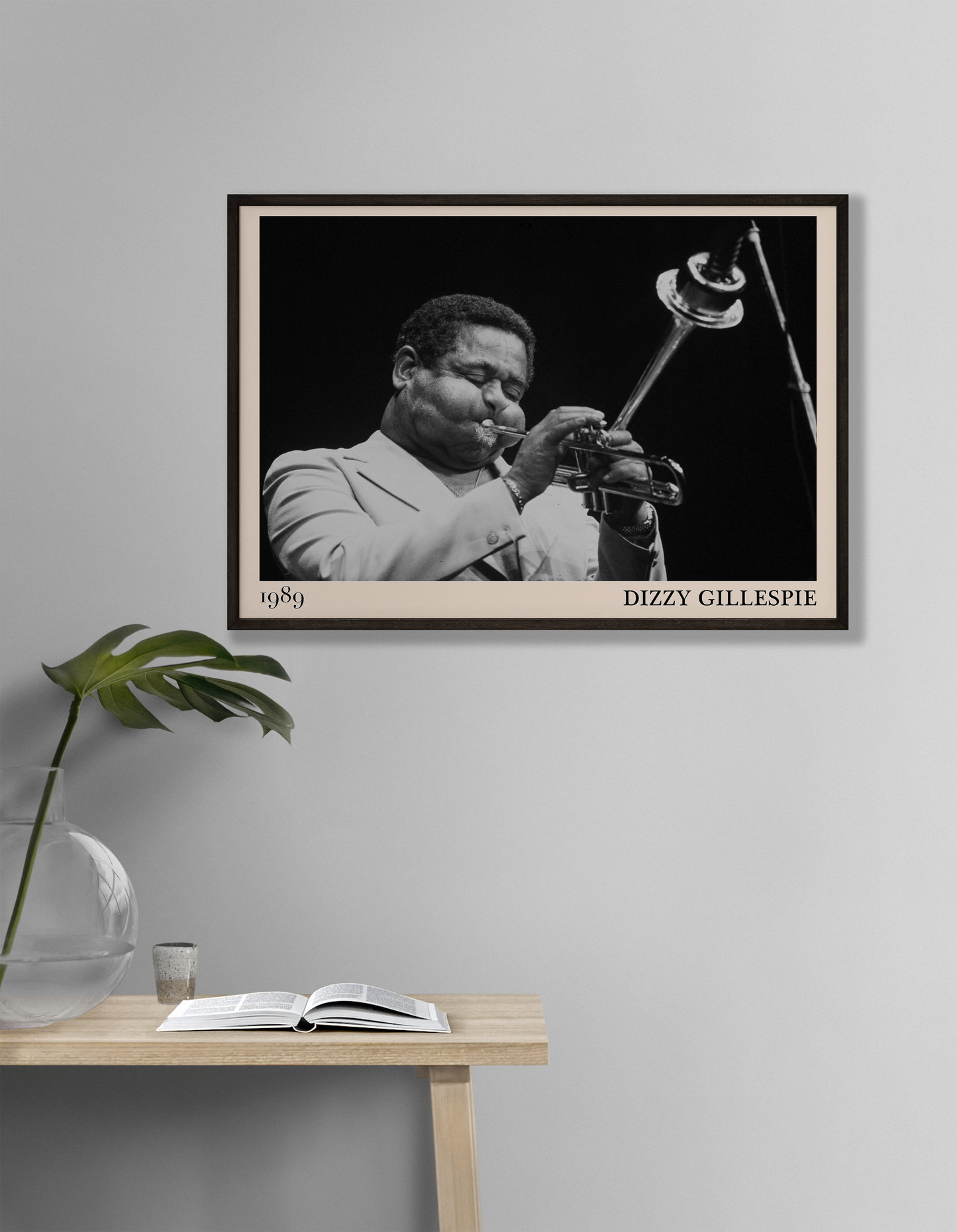 1989 photograph of Dizzy Gillespie playing the trumpet, transformed into a stylish black-framed jazz poster hanging on a white living room wall