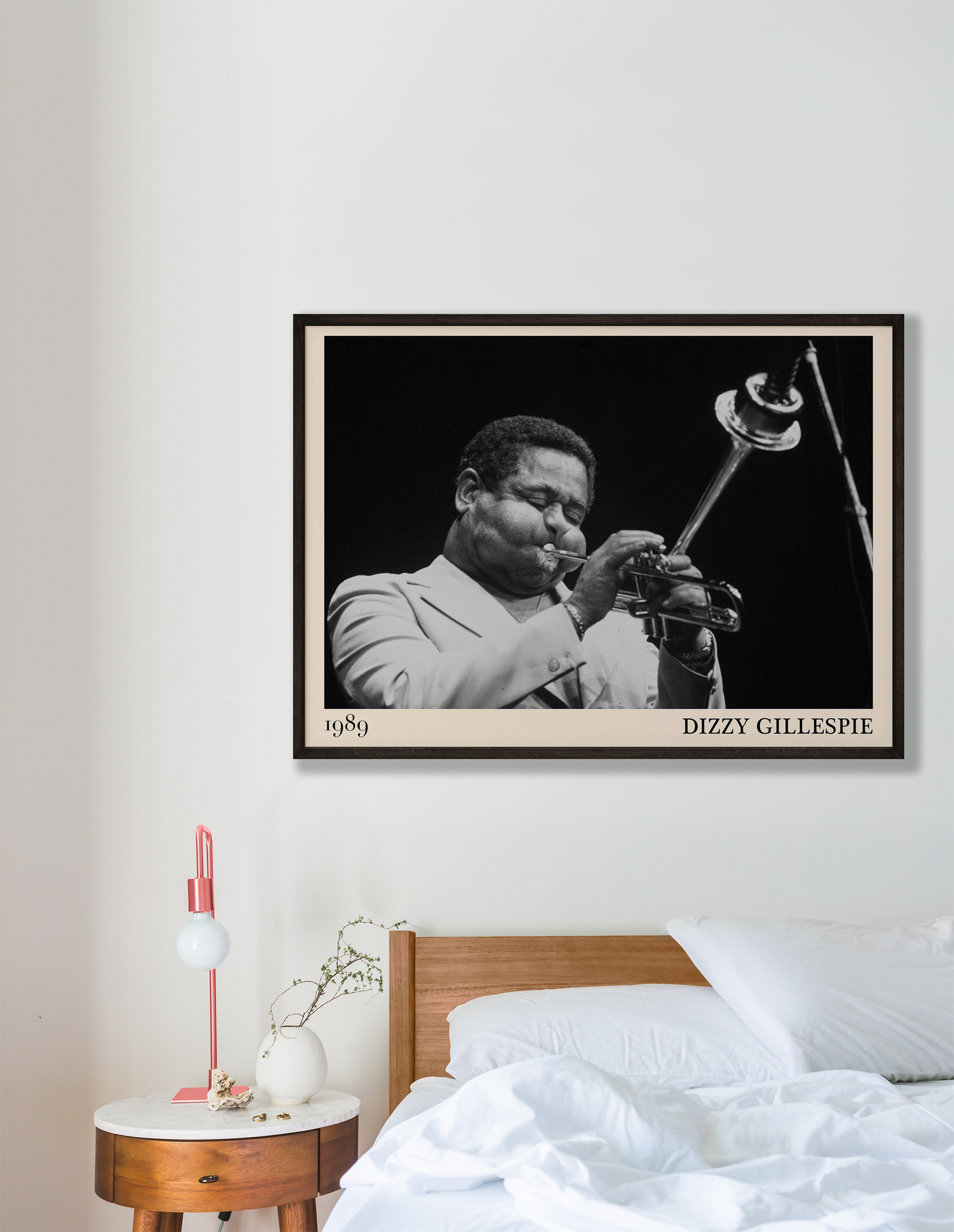 1989 photograph of Dizzy Gillespie playing the trumpet, transformed into a stylish black-framed jazz poster hanging on a white bedroom wall