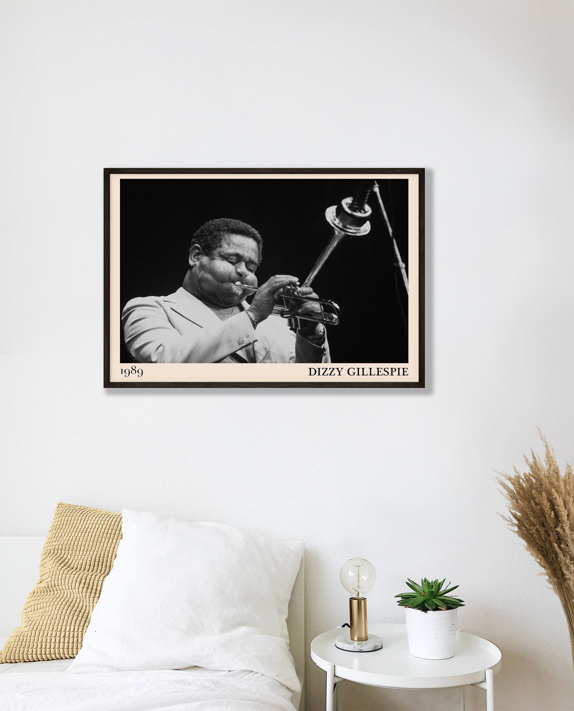 1989 photograph of Dizzy Gillespie playing the trumpet, transformed into a stylish black-framed jazz poster hanging on a white bedroom wall