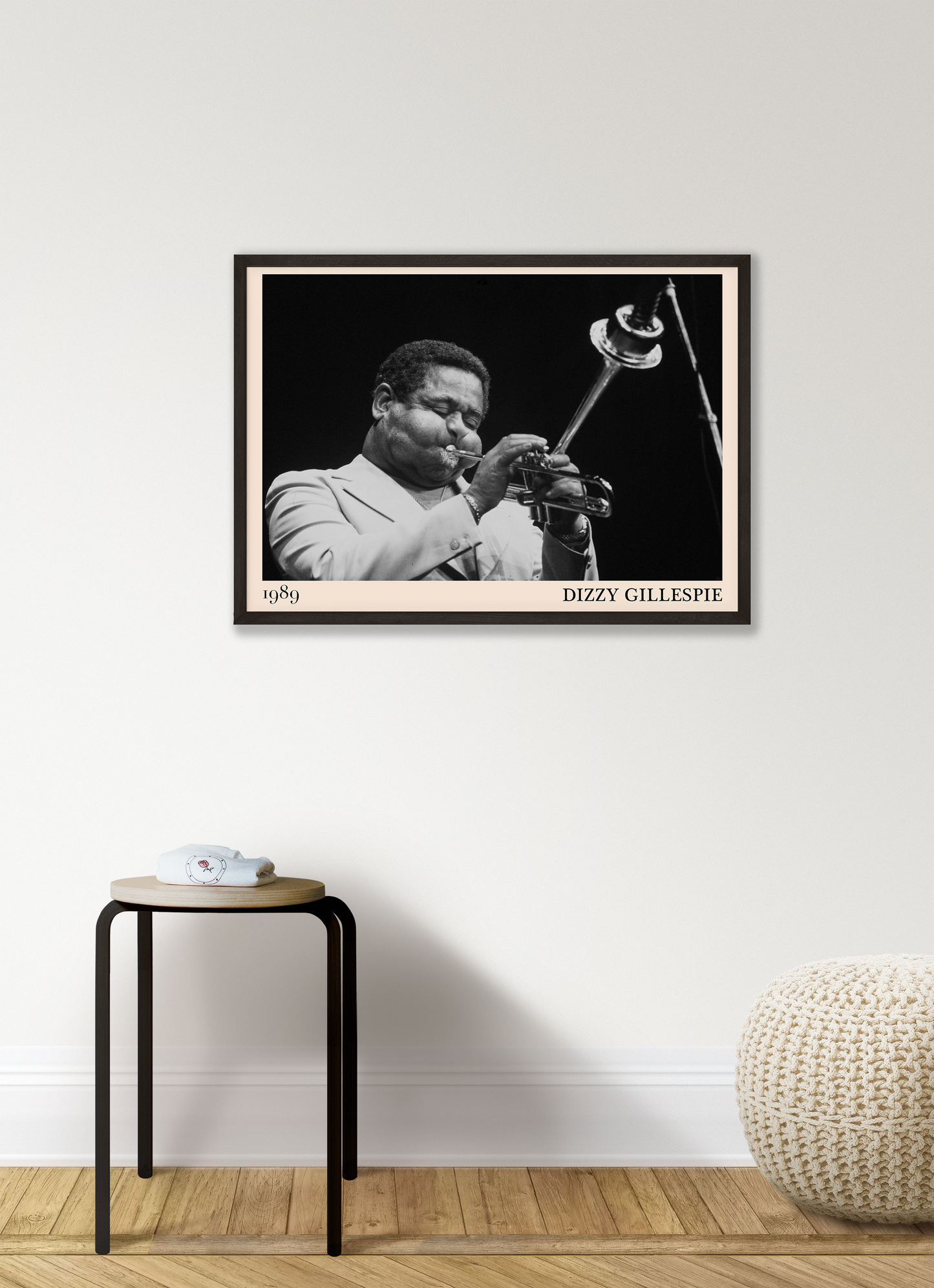 1989 photograph of Dizzy Gillespie playing the trumpet, transformed into a stylish black-framed jazz poster hanging on a white living room wall