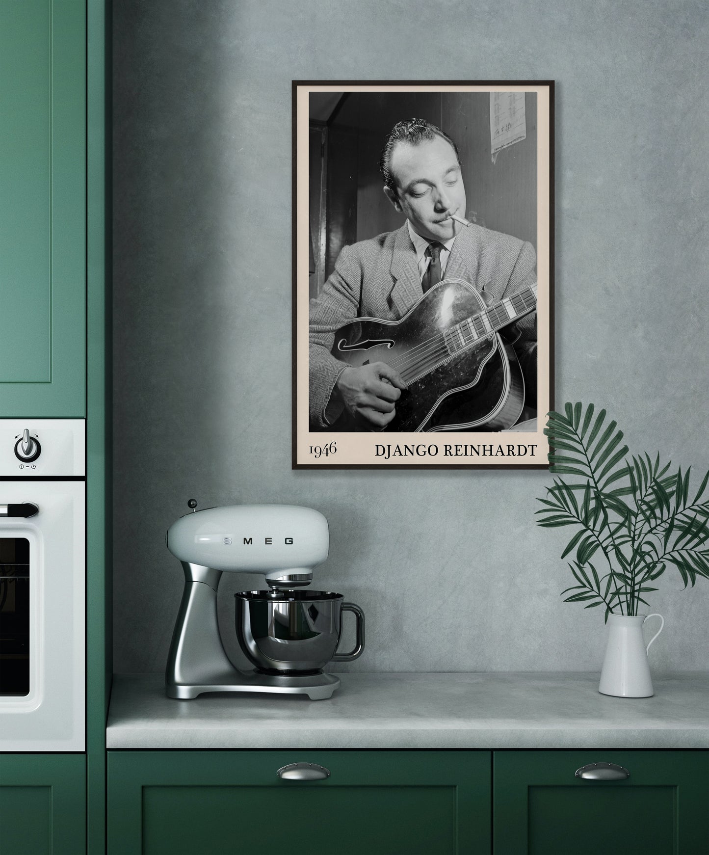 1946 photograph of Django Reinhardt playing the guitar. Transformed into a cool black-framed jazz poster hanging on a grey kitchen wall